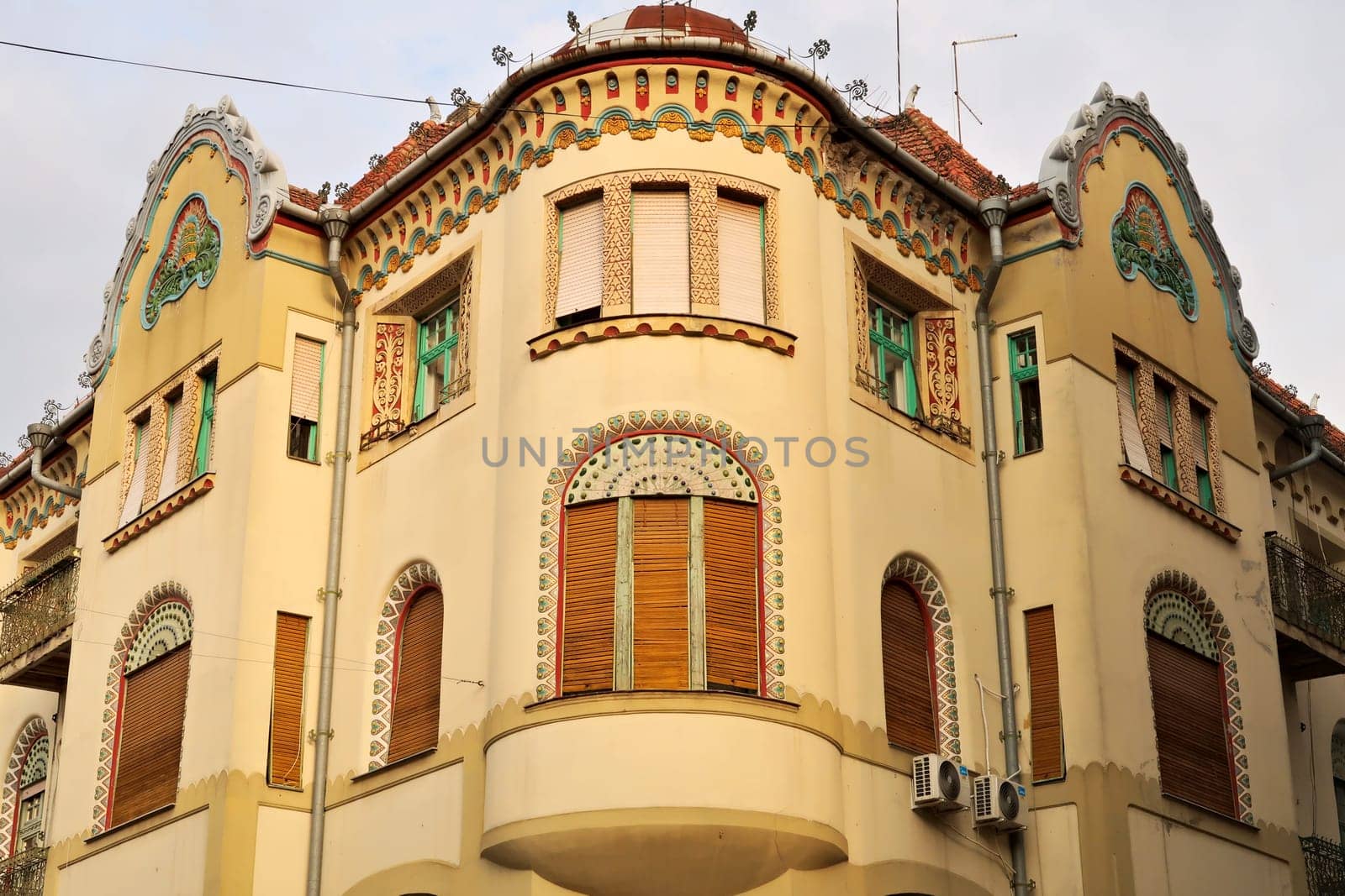 The facade and bay window of the Savings Bank Palace building, an example of Art Nouveau architecture in the city center of Subotica, Serbia 2022