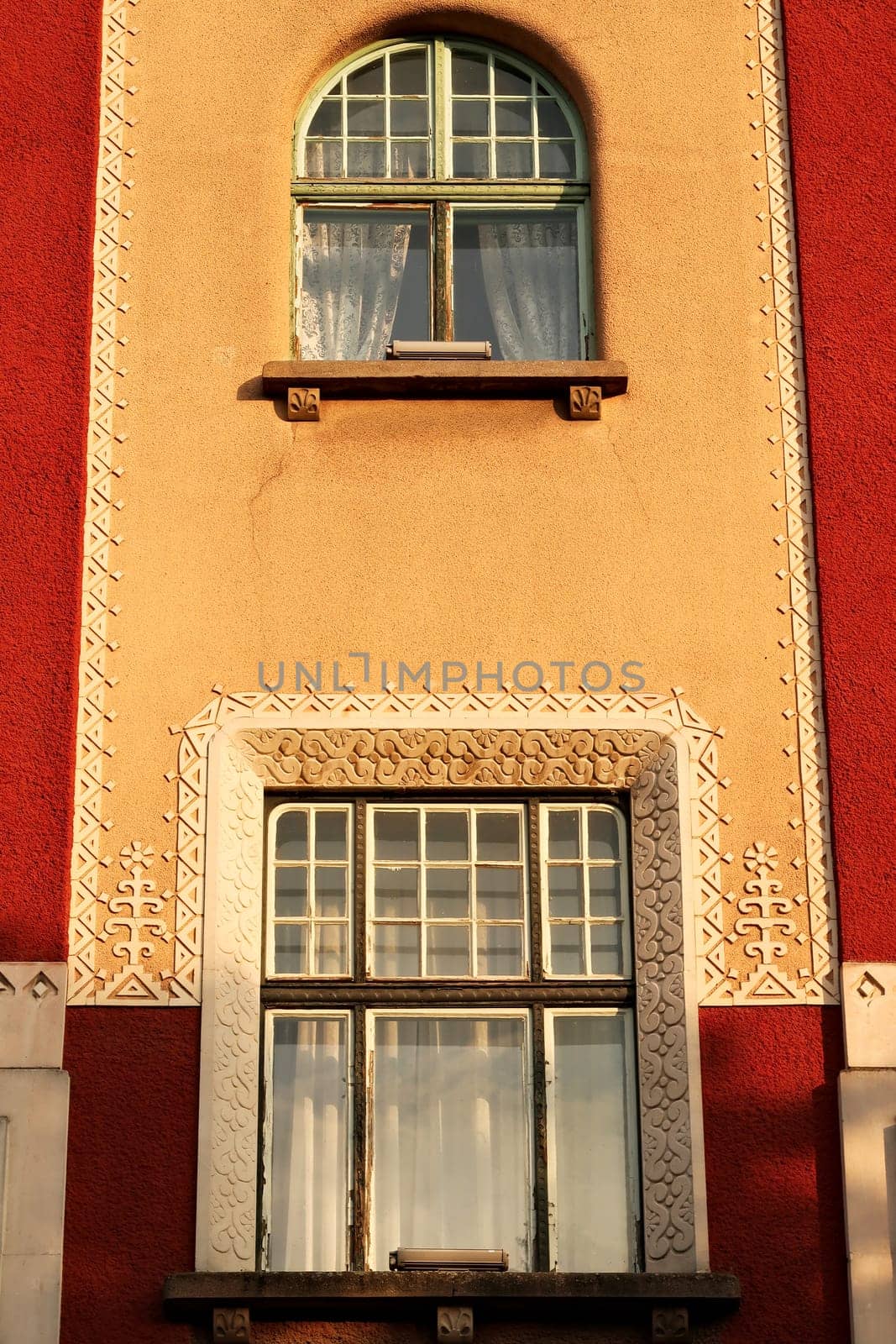 Two windows on the facade of the city hall, town hall of Subotica, an example of Art Nouveau architecture in the city center, Subotica, Serbia 2022
