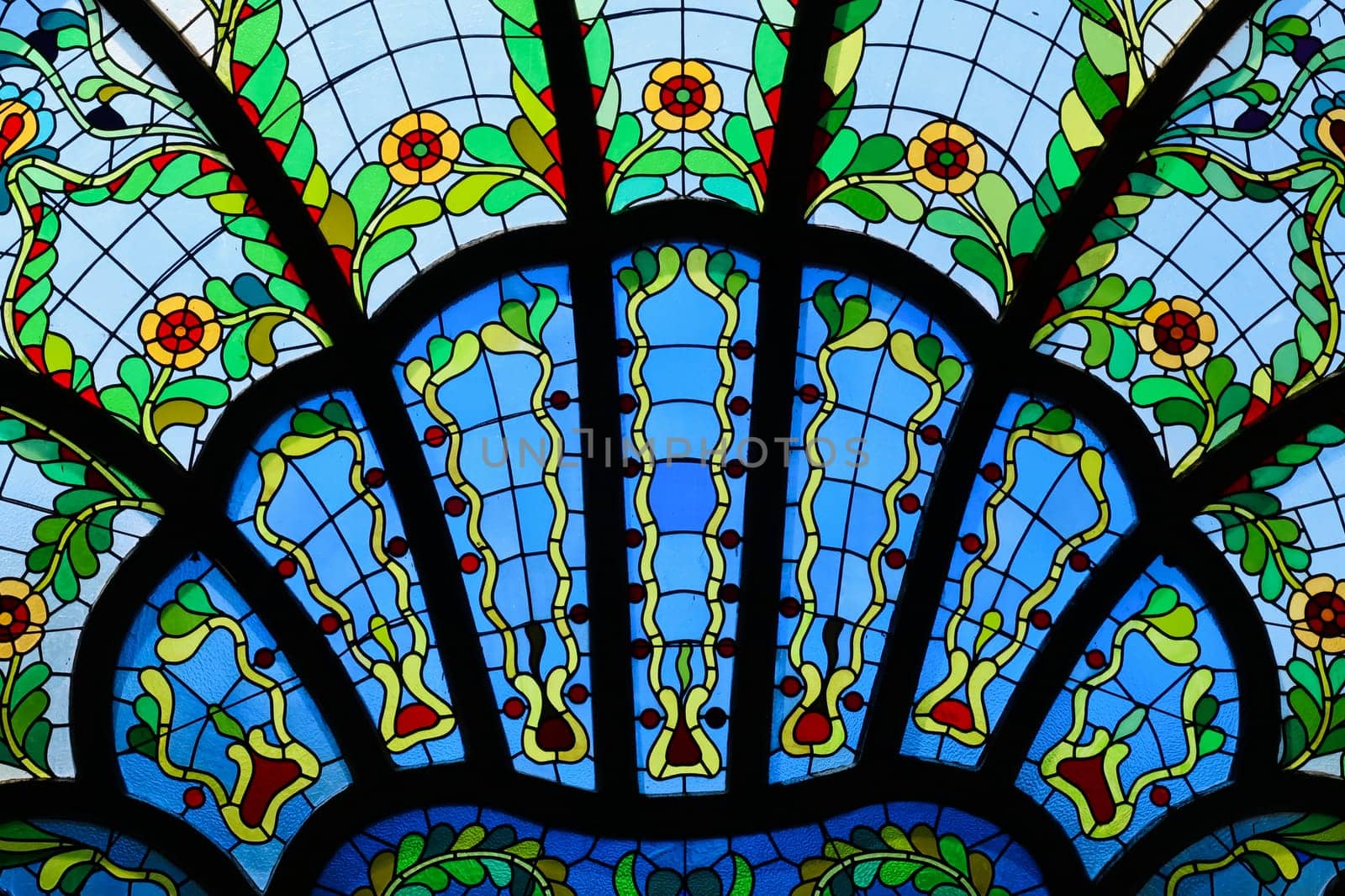 Close look on a stained glass window in different shades of blue inside the Synagogue of Subotica, second floor, Subotica, Serbia 2022