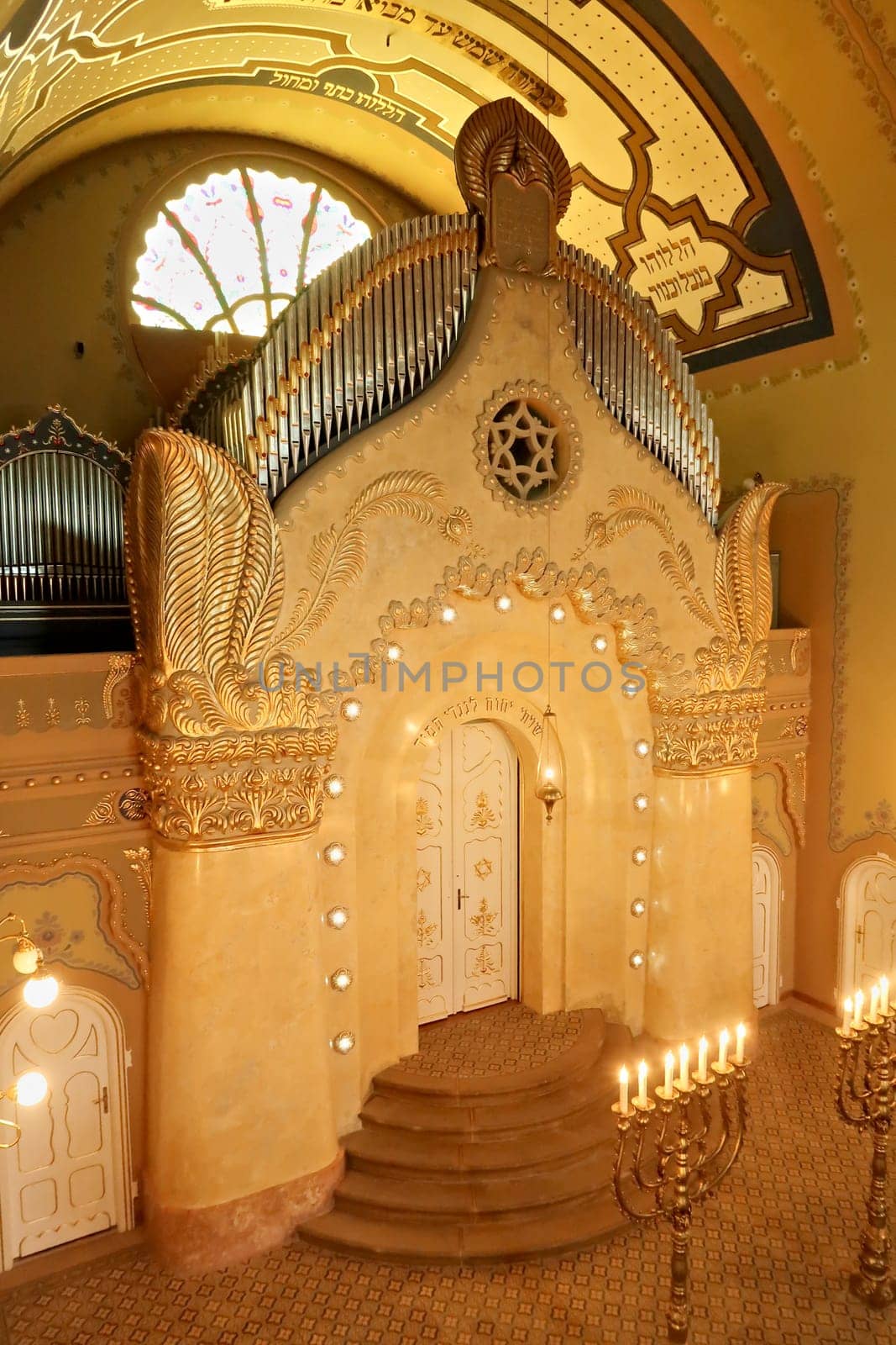 The elaborate altar inside the Synagogue of Subotica, illuminated by lights and candles, Subotica, Serbia 2022