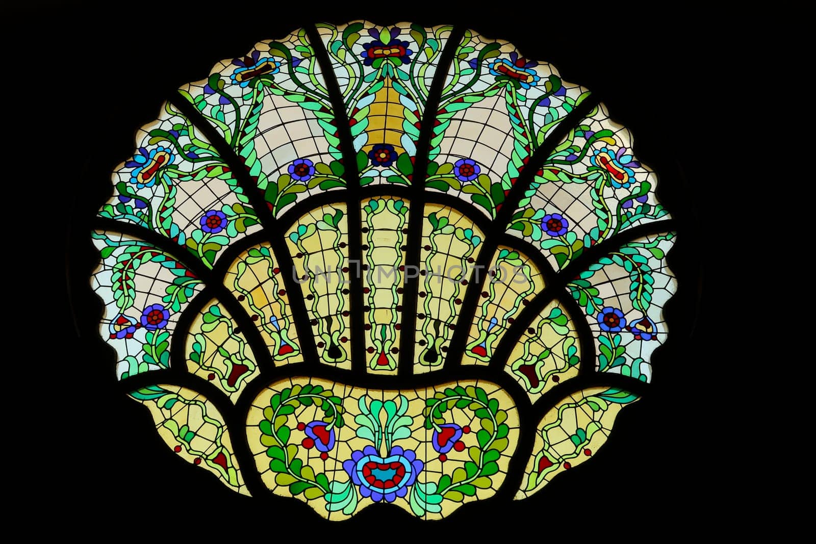 Stained glass window in different shades of green inside the Synagogue of Subotica, second floor, Subotica, Serbia 2022