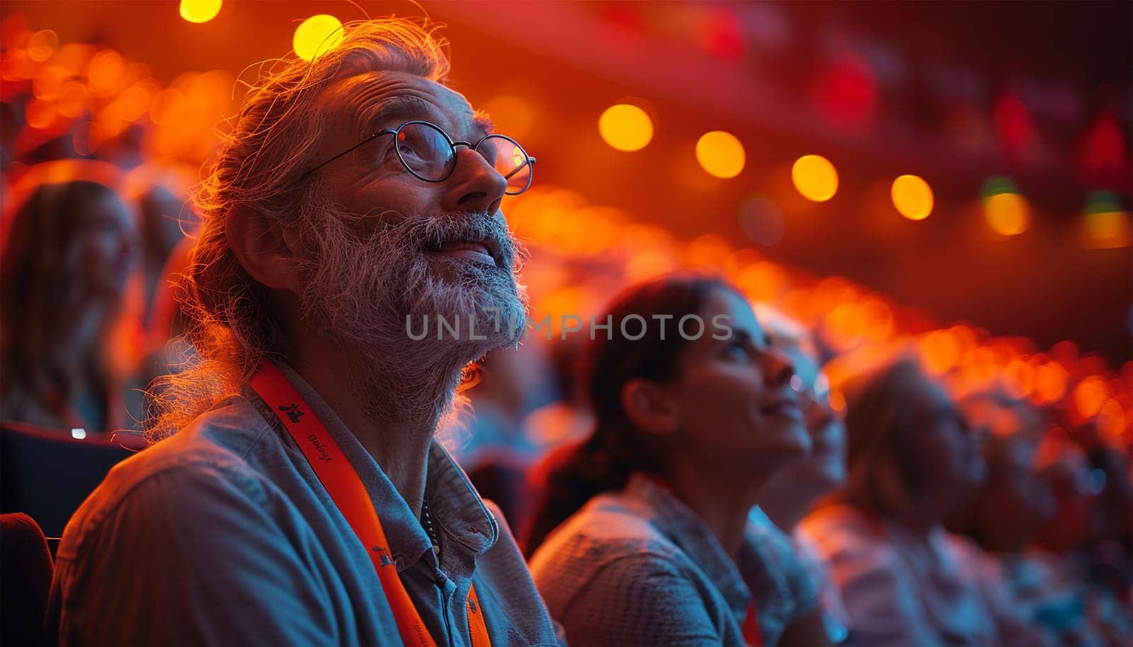 Audience at the modern conference hall listens to panel discussion, people on a congress together listen to speaker on stage at convention, business seminar, amphitheater venue for congress