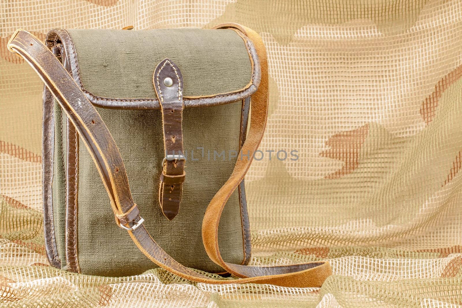 Old vintage canvas bag with leather strap