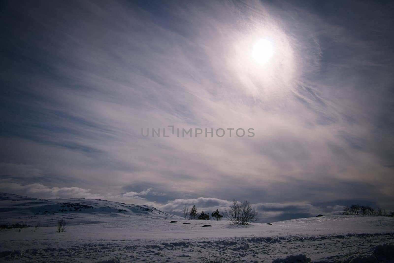 Norwegian high mountains in the snow. White landscape with defused light. Scandinavian landscape in the far north