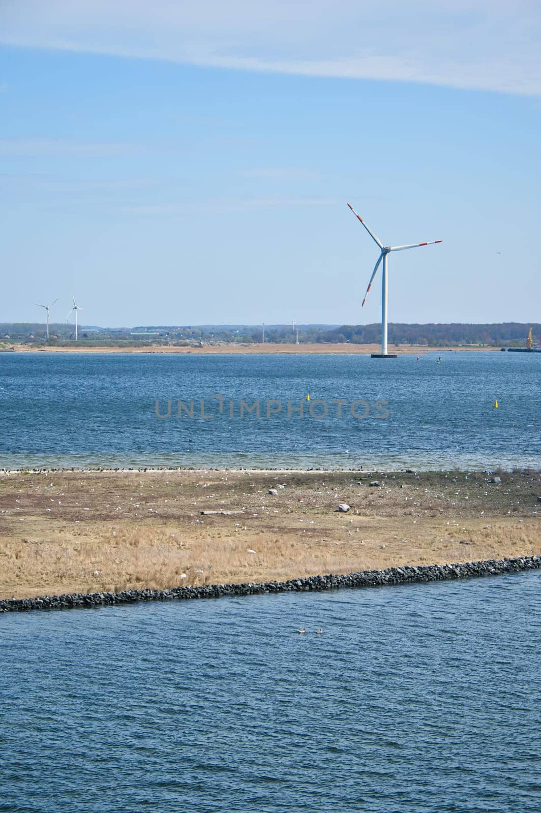 Offshore wind turbine in the sea, on the coast. Green energy of the future. Renewable energy supply. In the fight against climate change. Green electricity
