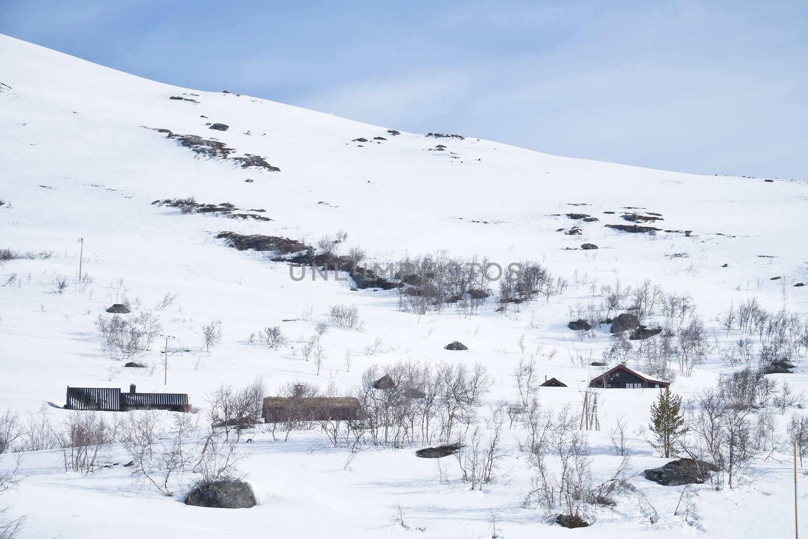 Norwegian high mountains in the snow. Mountains covered in snow. Scandinavian landscape in the far north