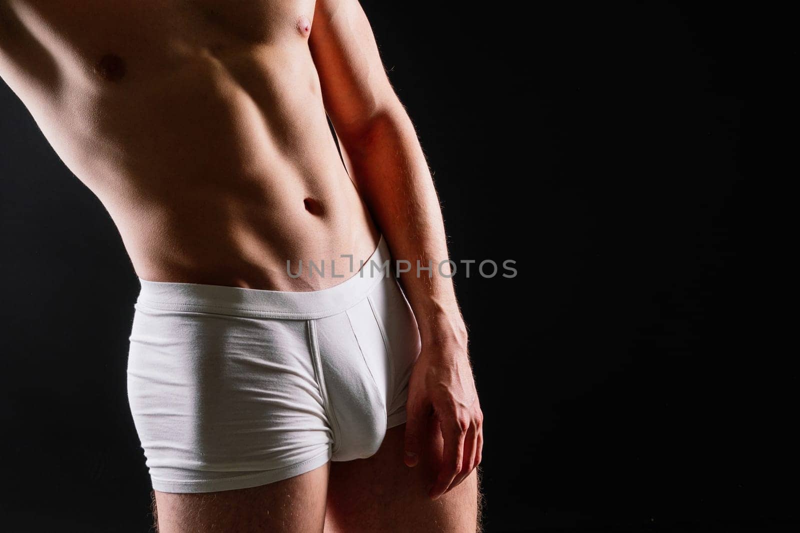 Close up on perfect abs. Strong bodybuilder with six packs