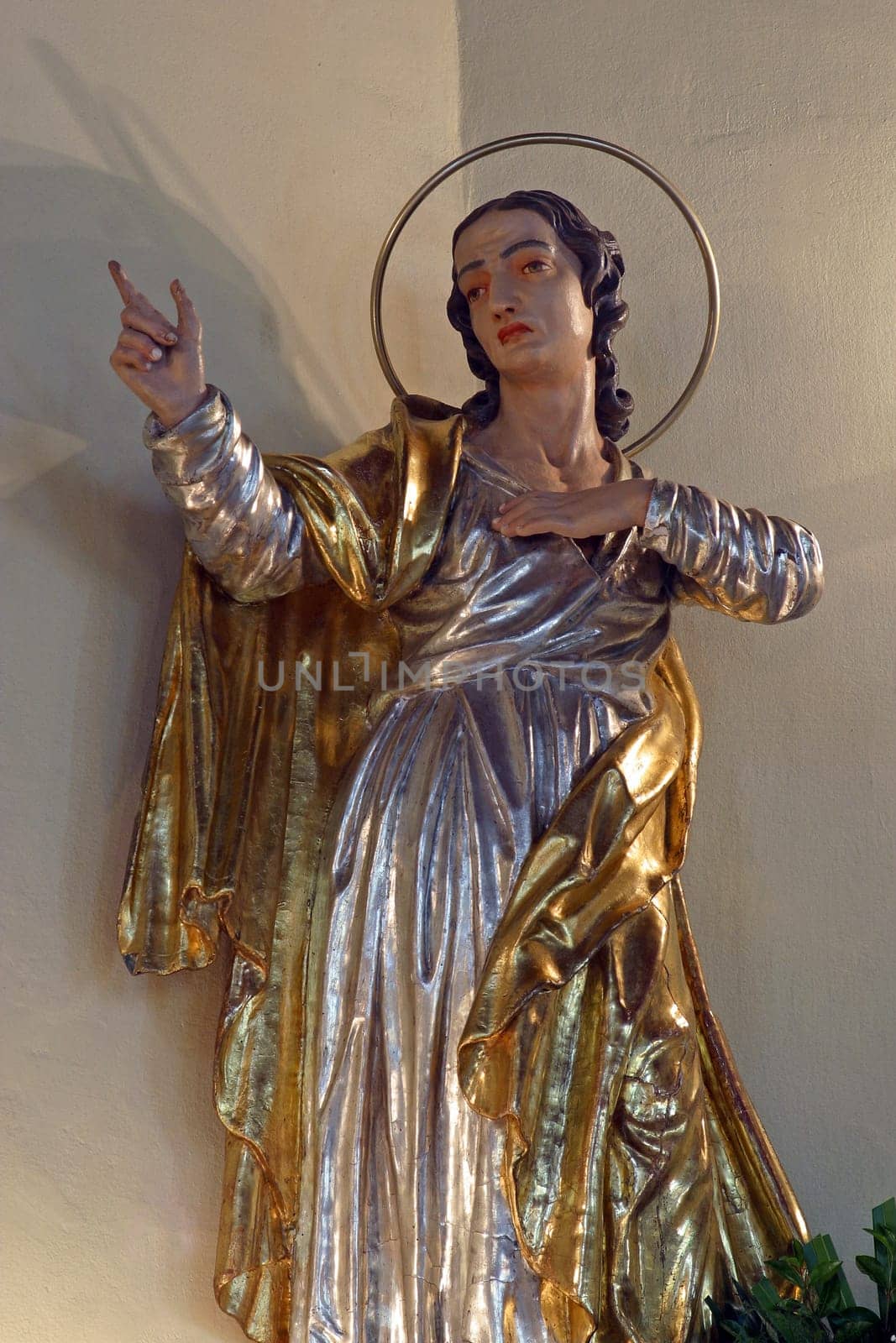 Saint John under the cross, statue on the main altar in the parish church Elevation of the Holy Cross in Kravarsko Croatia