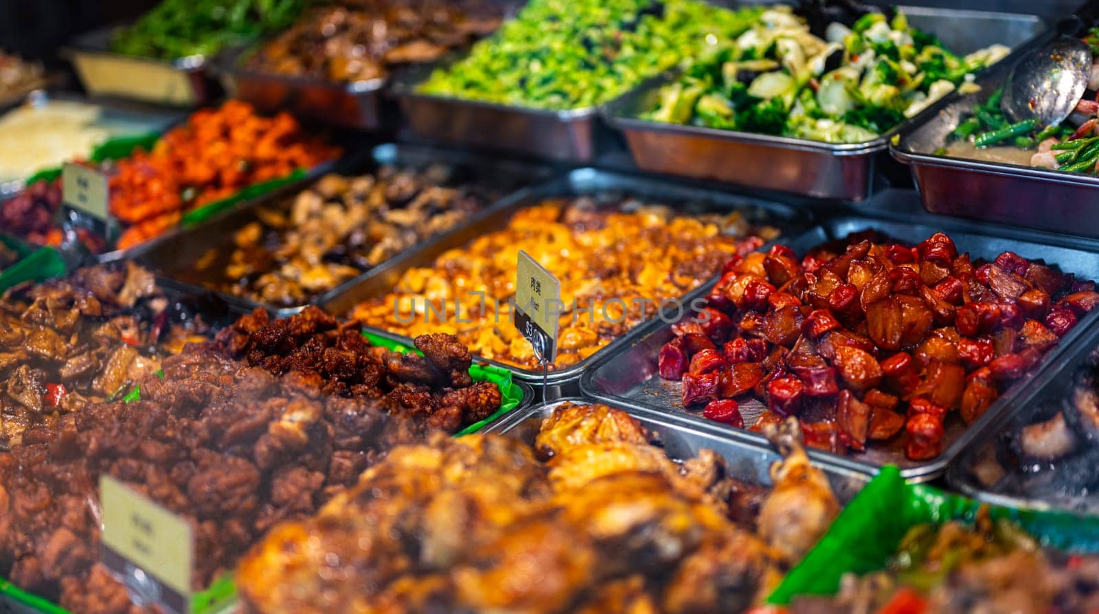 Traditional Asian dishes sold in a shopping mall food court in Singapore.