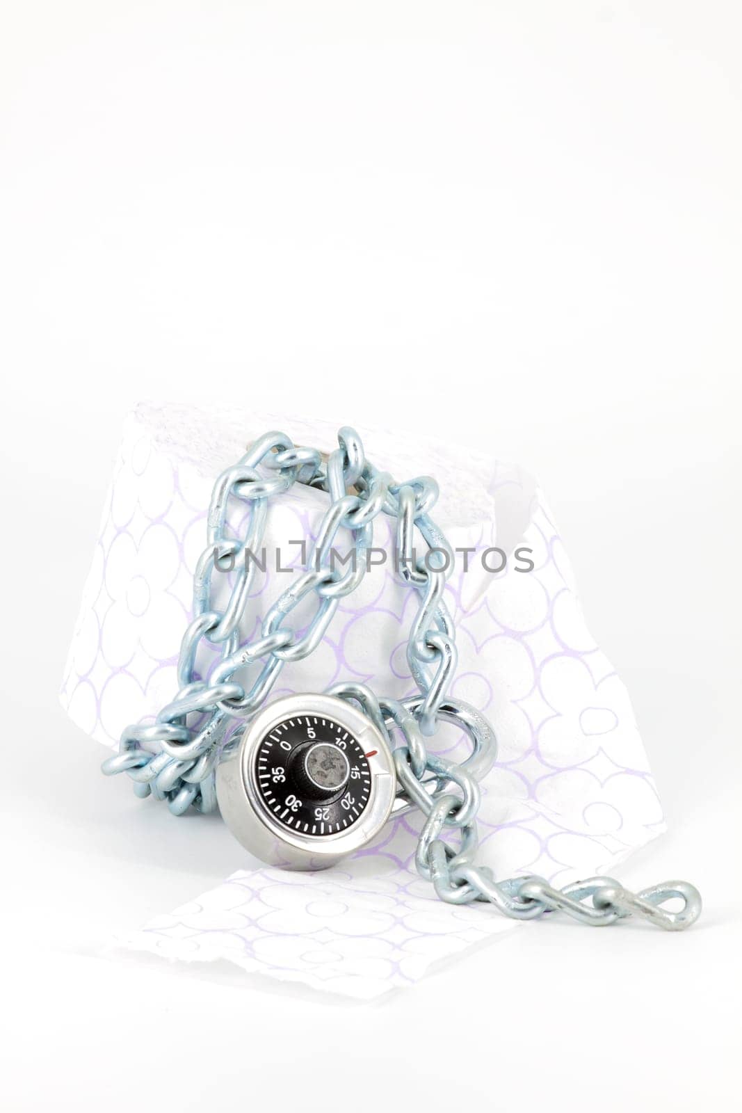 Roll toilet paper locked with padlock and chain on white background