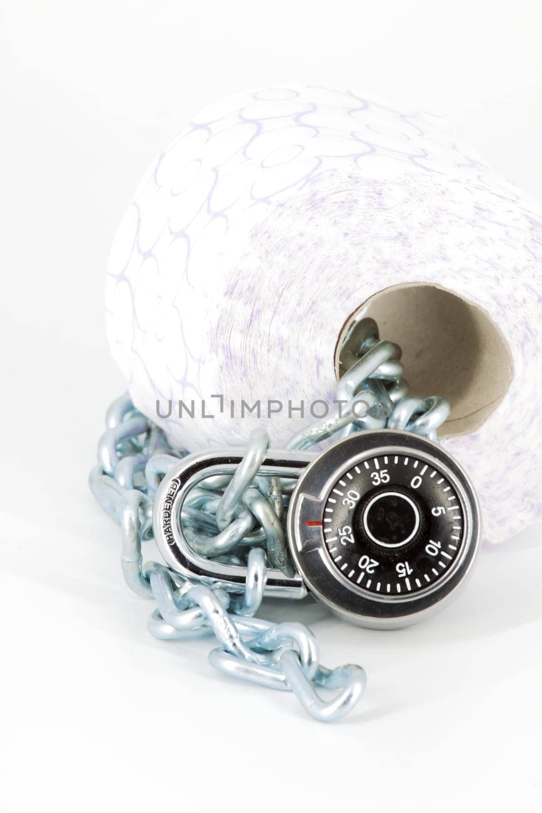 Roll toilet paper locked with padlock and chain on white background