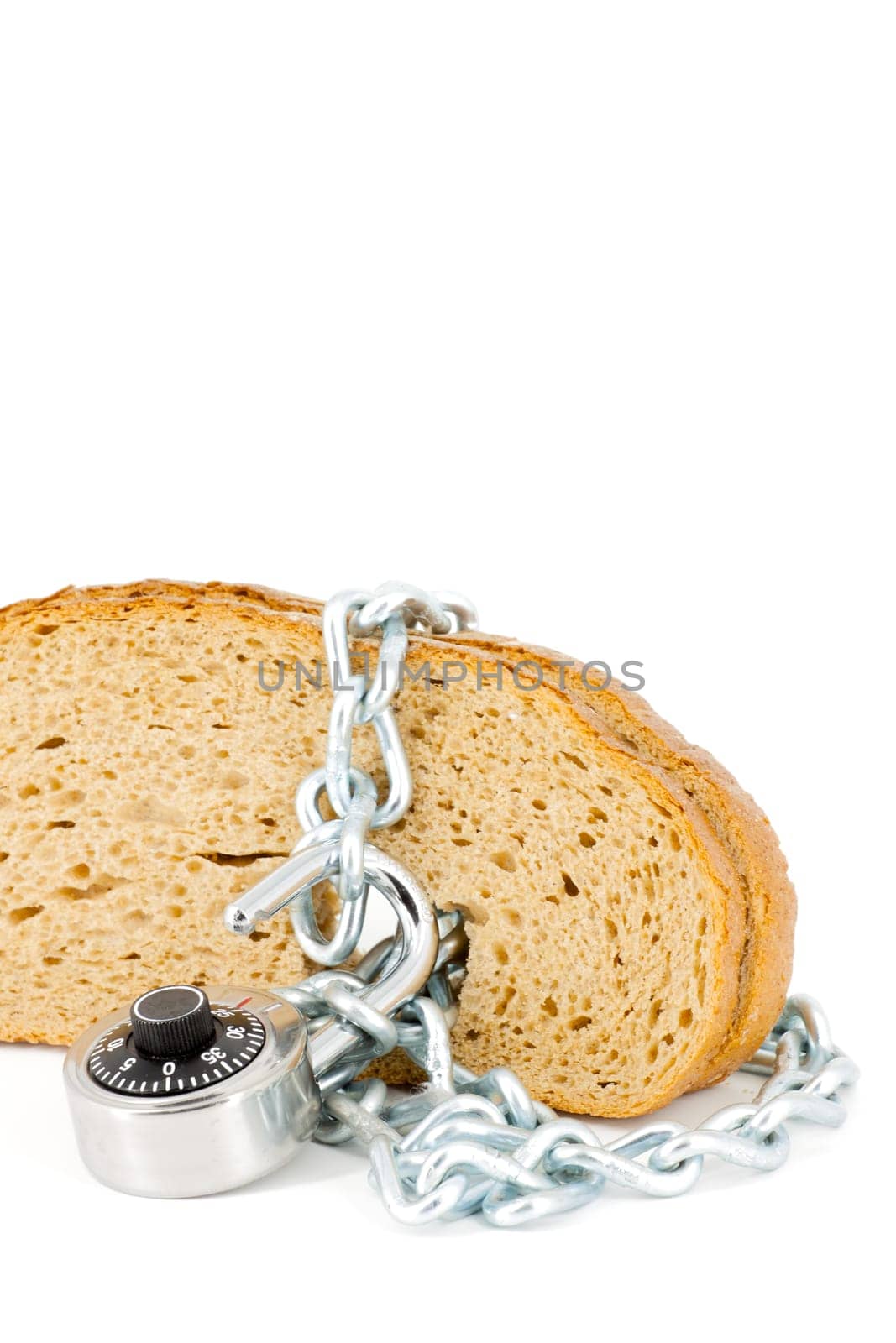 Slices of bread locked with chain and padlock on a white background