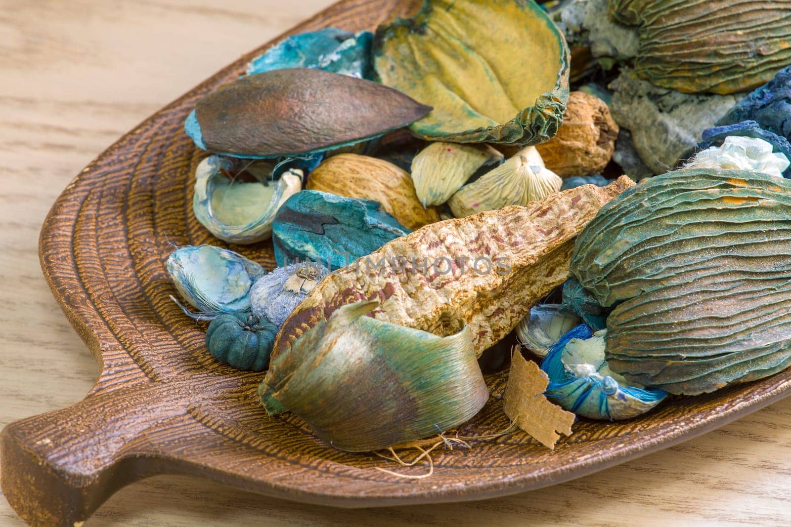 Aromatic dried fruit flowers and leaves on a wooden stand