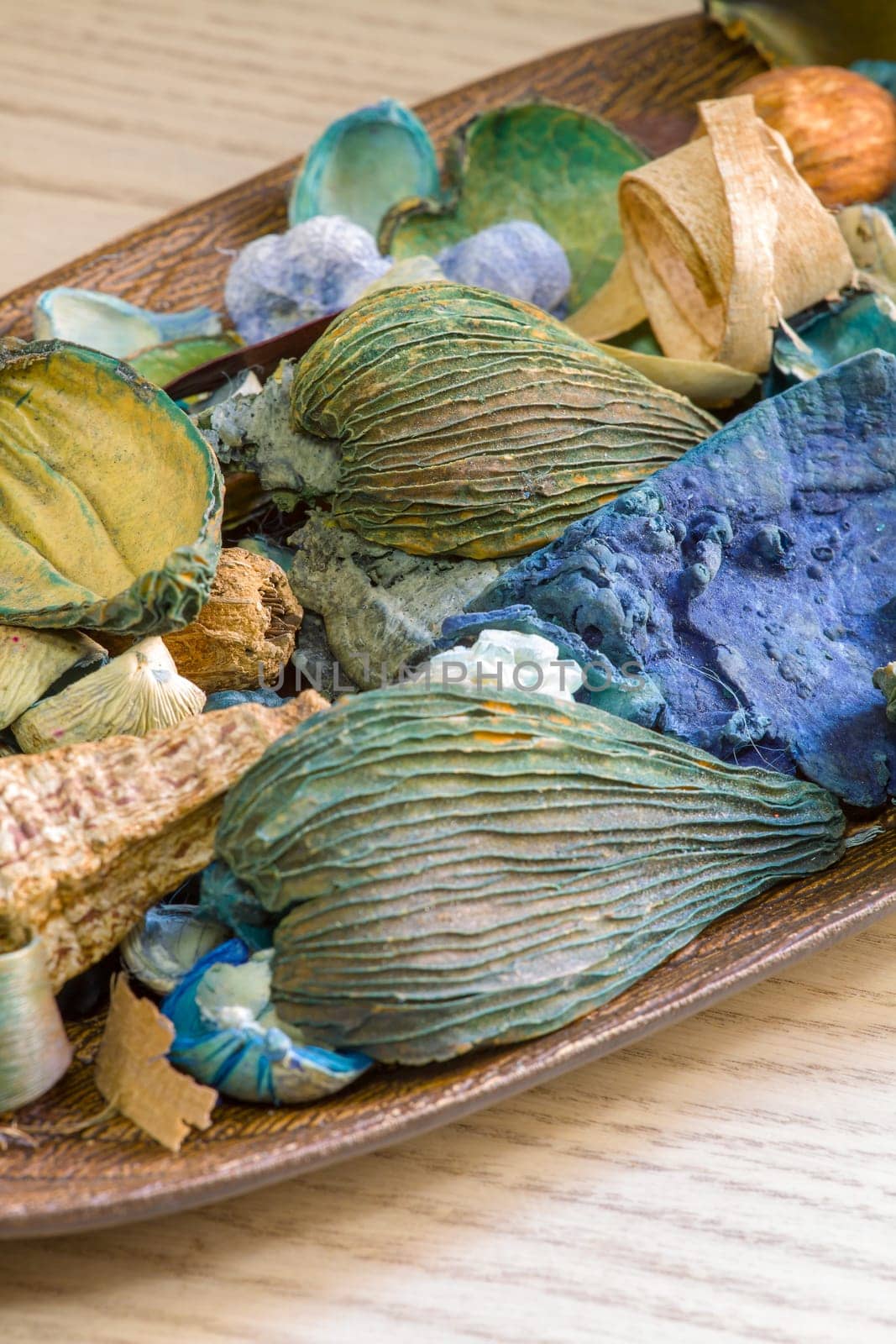 Aromatic dried fruit flowers and leaves on a wooden stand