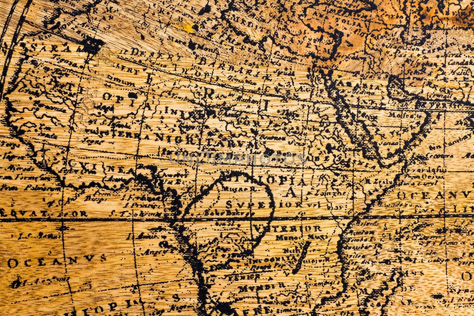 Old Geographic map of the world printed on a wooden board