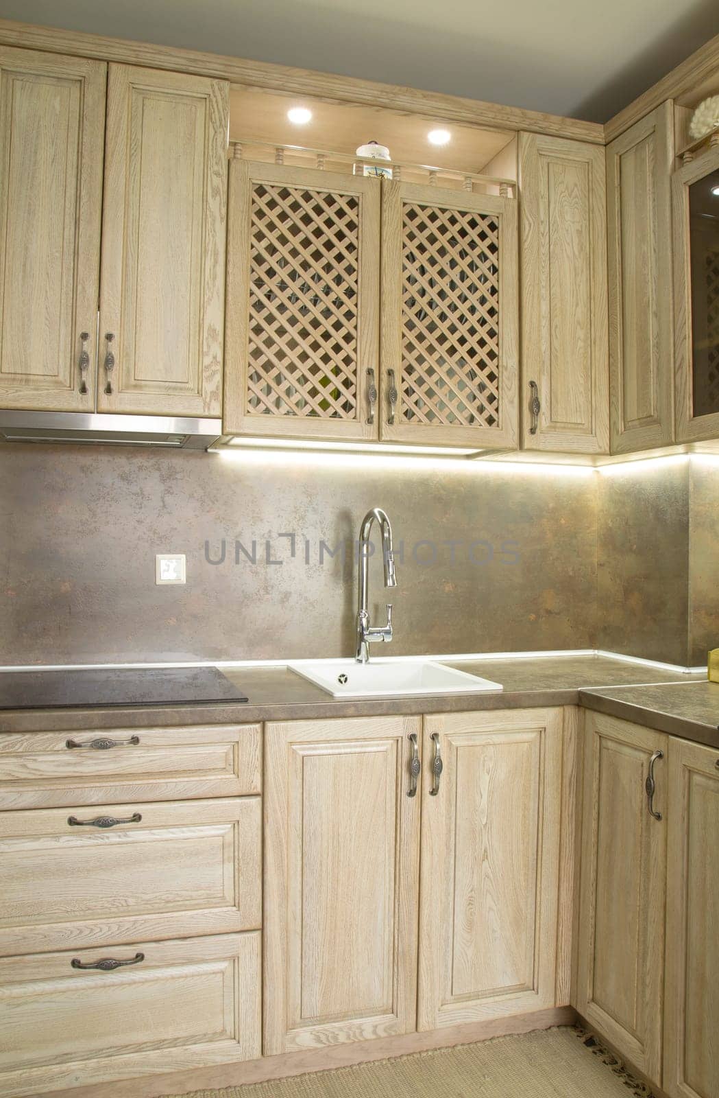 Details of vintage style kitchen furniture in beige brown color
