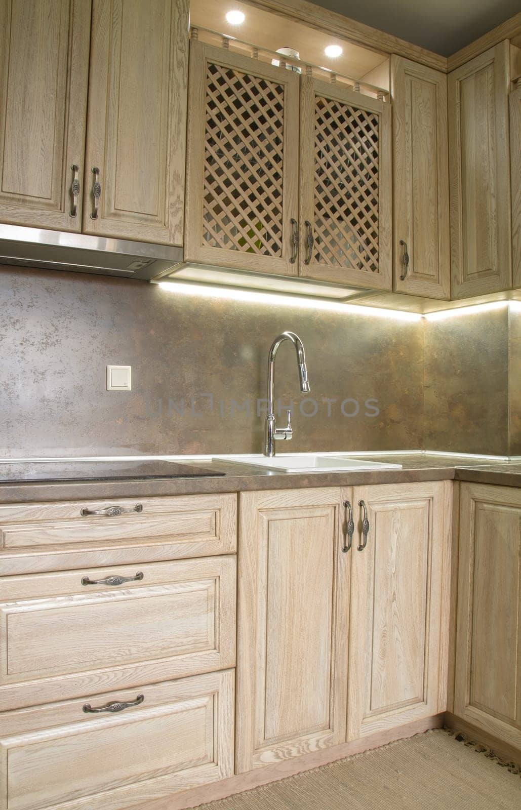 Details of vintage style kitchen furniture in beige brown color