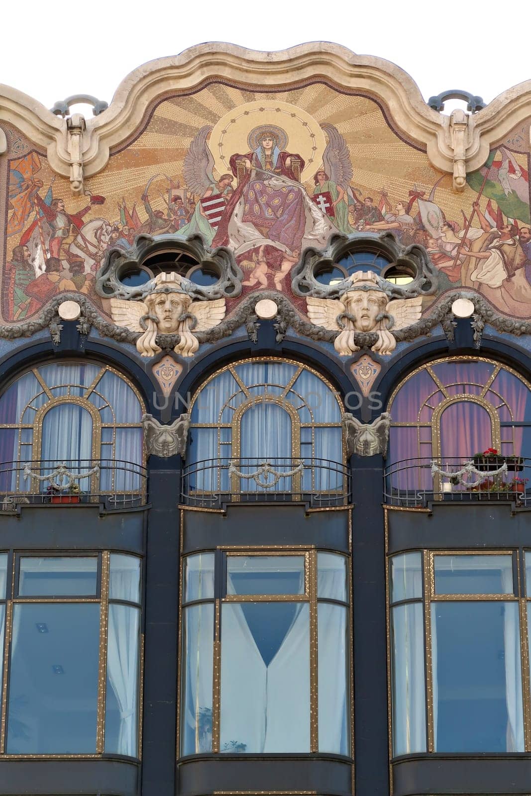 Windows and colorful mosaic, wall painting on the upper facade of the Török, Torok, Turkish Bank House, an example of Art Nouveau architecture in the city center of Budapest, Hungary 2022