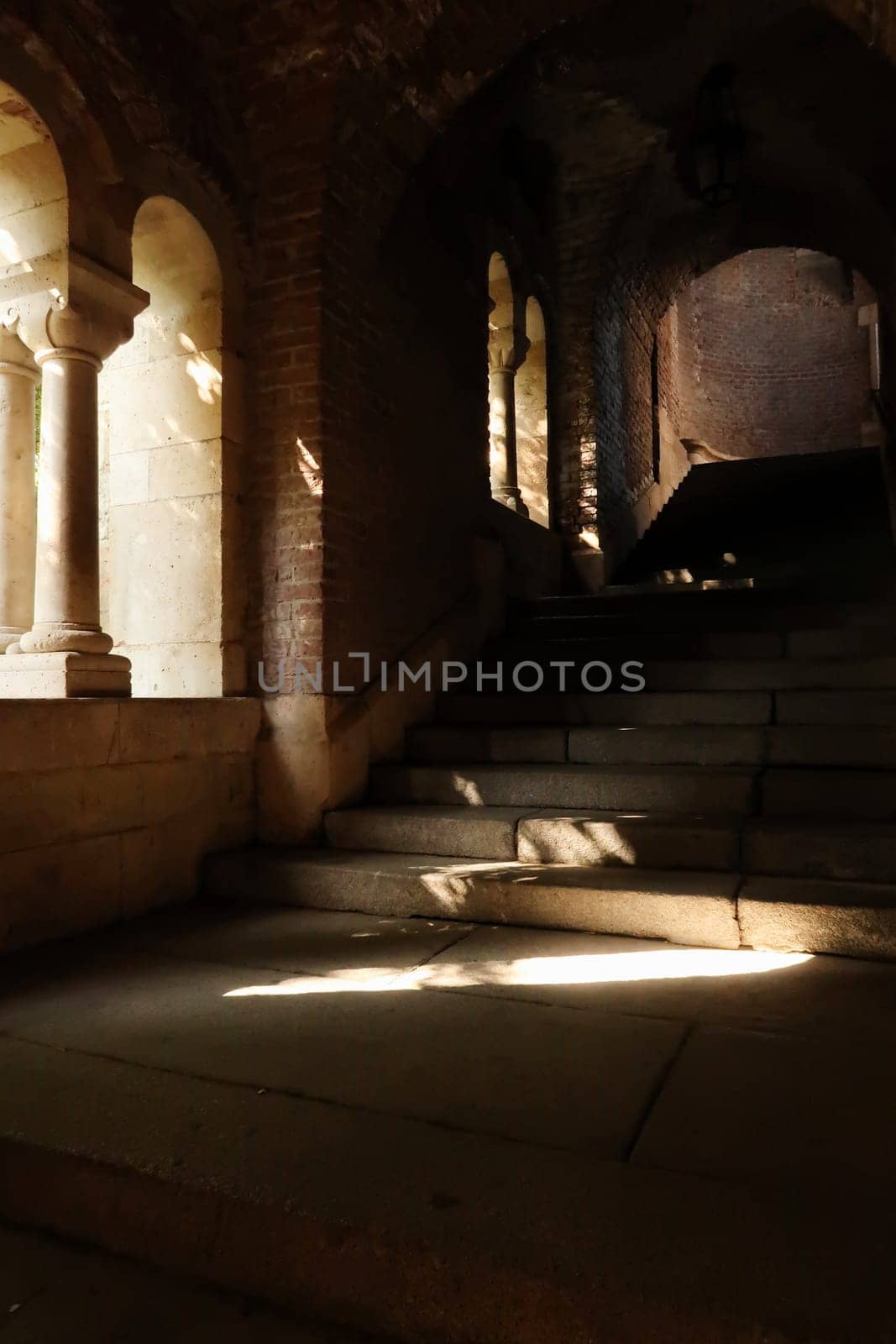 Stone stairs, vaults and windows with pillars inside the Fisherman's Bastion in the city center of Budapest, Hungary 2022