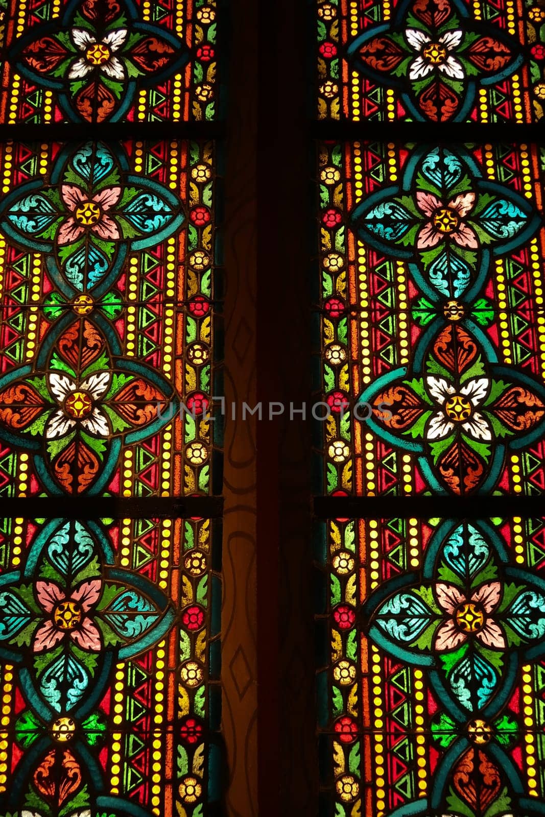 Closer look on the stained glass window behind the bust, statue of Empress Elisabeth of Austria, Sissi, Sisi inside the Matthias Church, Budapest, Hungary 2022