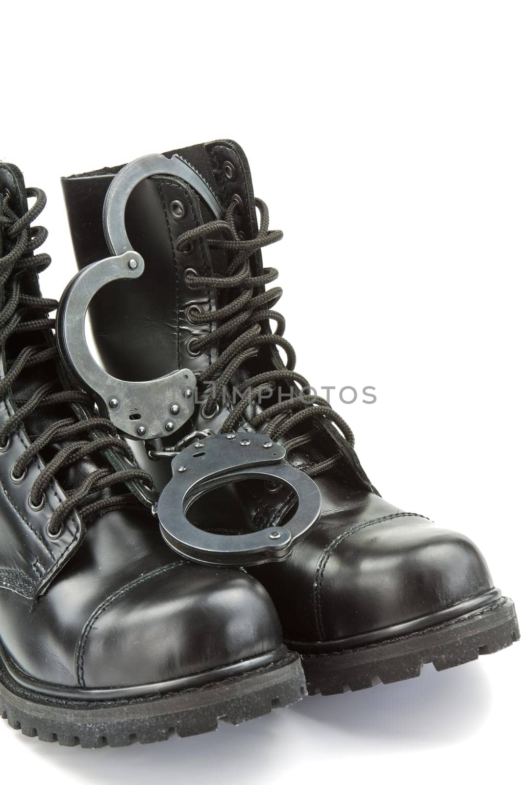Police boots and handcuffs - equipment and aids or fetish
