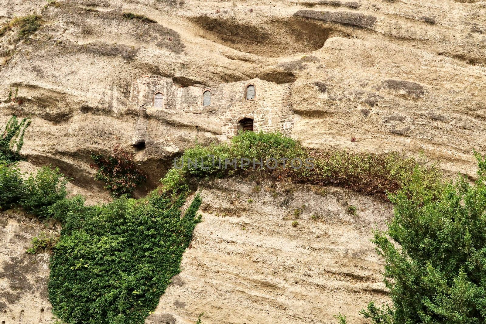 View onto the hidden facade of the Maximus Chapel, Cave, Maximuskapelle, Maximushöhle, built into a cave in a cliff of the Festungsberg, part of the Catacombs of Salzburg at the St. Peter*s Cemetery, Salzburg, Austria 2022