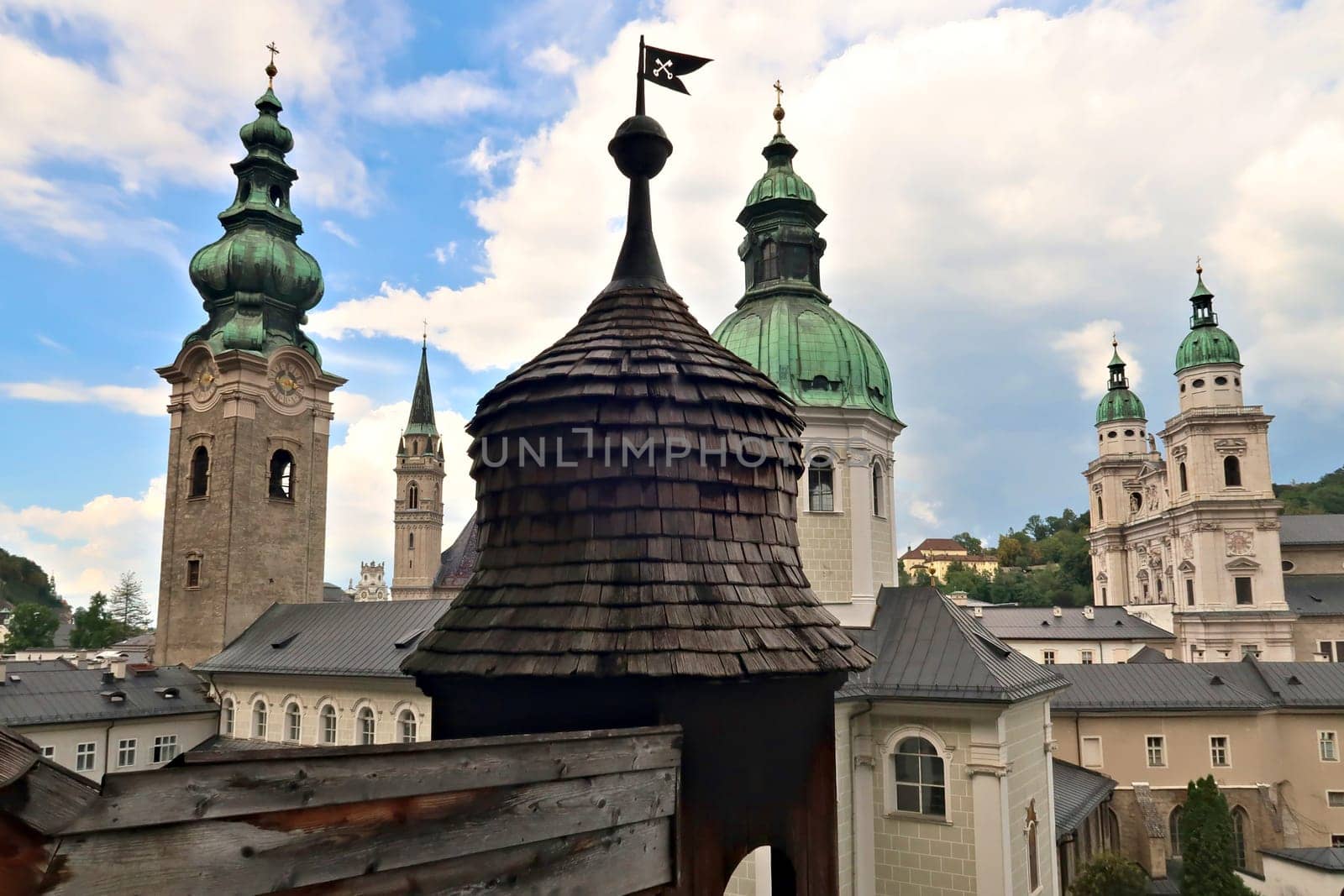 Inside the catacombs of Salzburg at the St., Saint Peter's Cemetery, Petersfriedhof, view from the Getrauden Chapel, Getraudenkapelle onto many bell, clock towers, Salzburg, Austria 2022