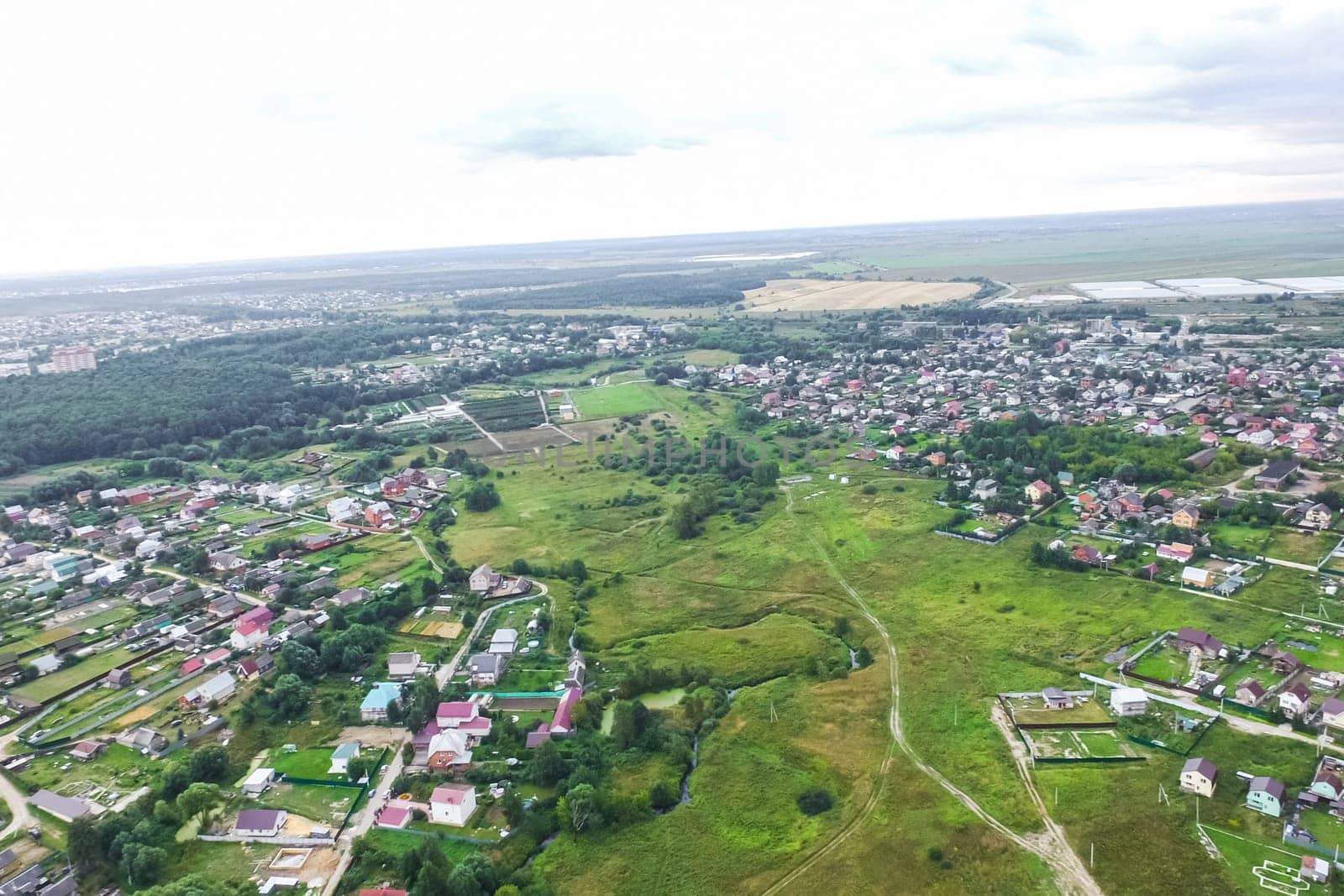 Top view of the village, fields and forests near the village