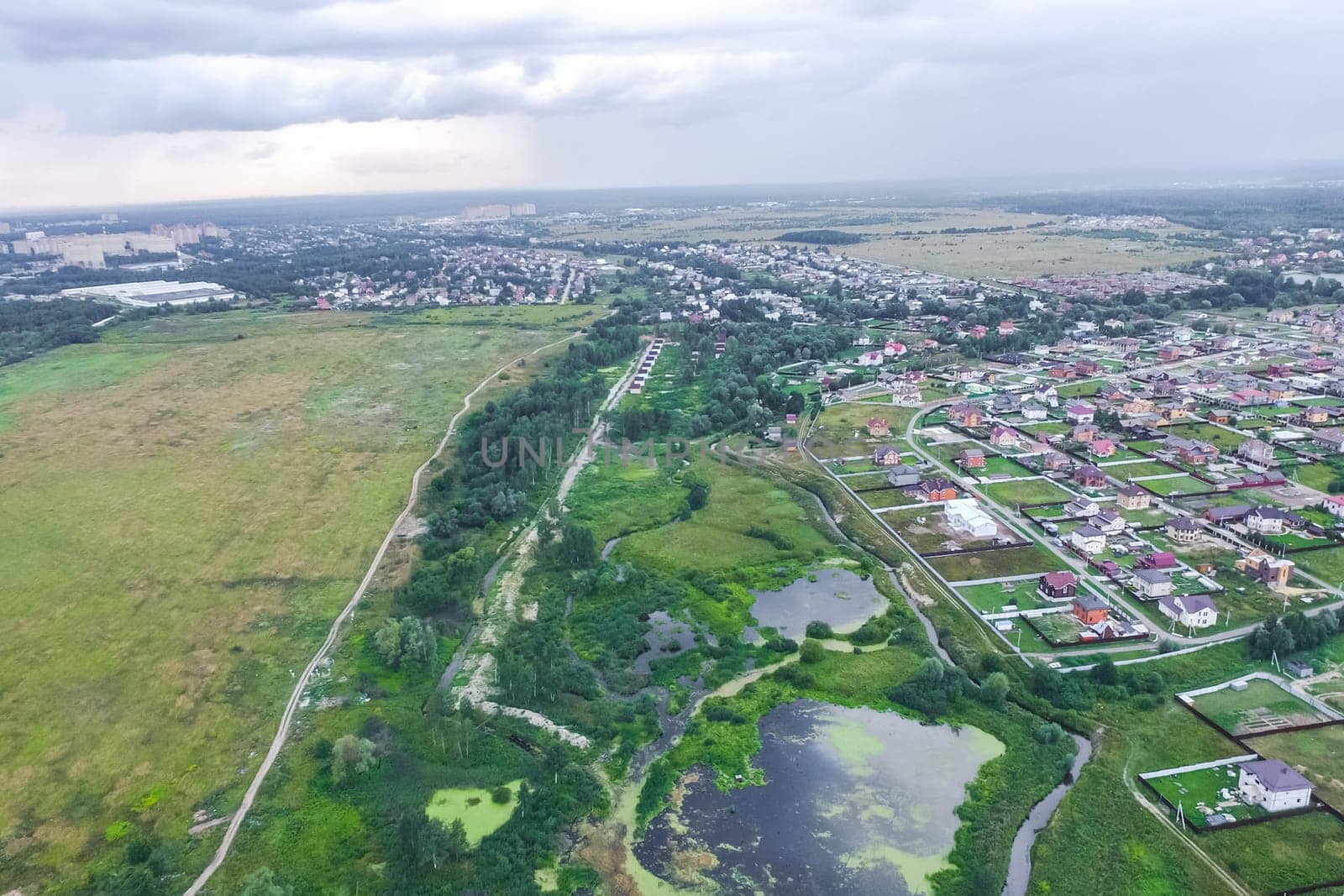 Top view of the village, fields and forests near the village