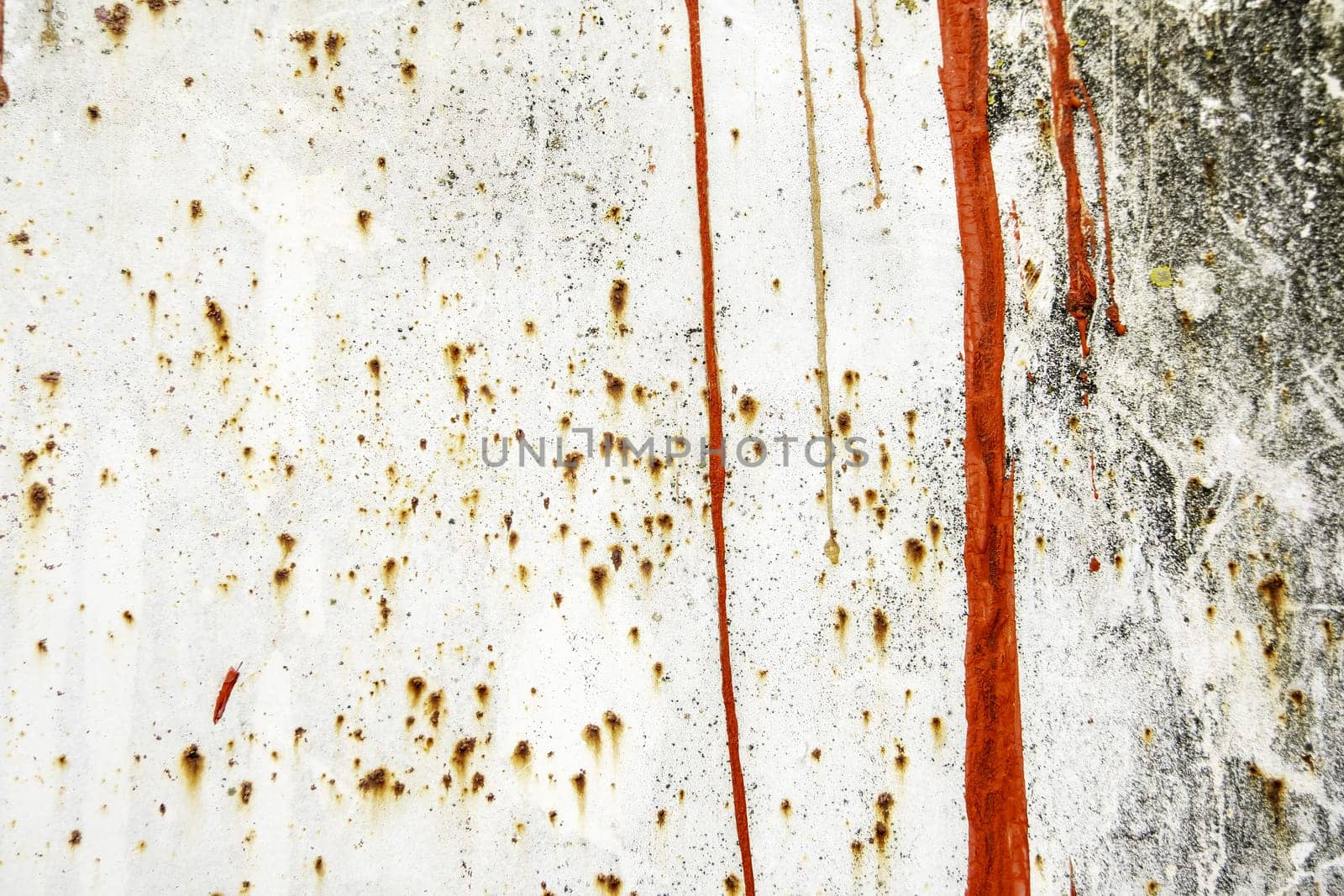 Detail of damaged and rusty metal wall, abandonment and ruin