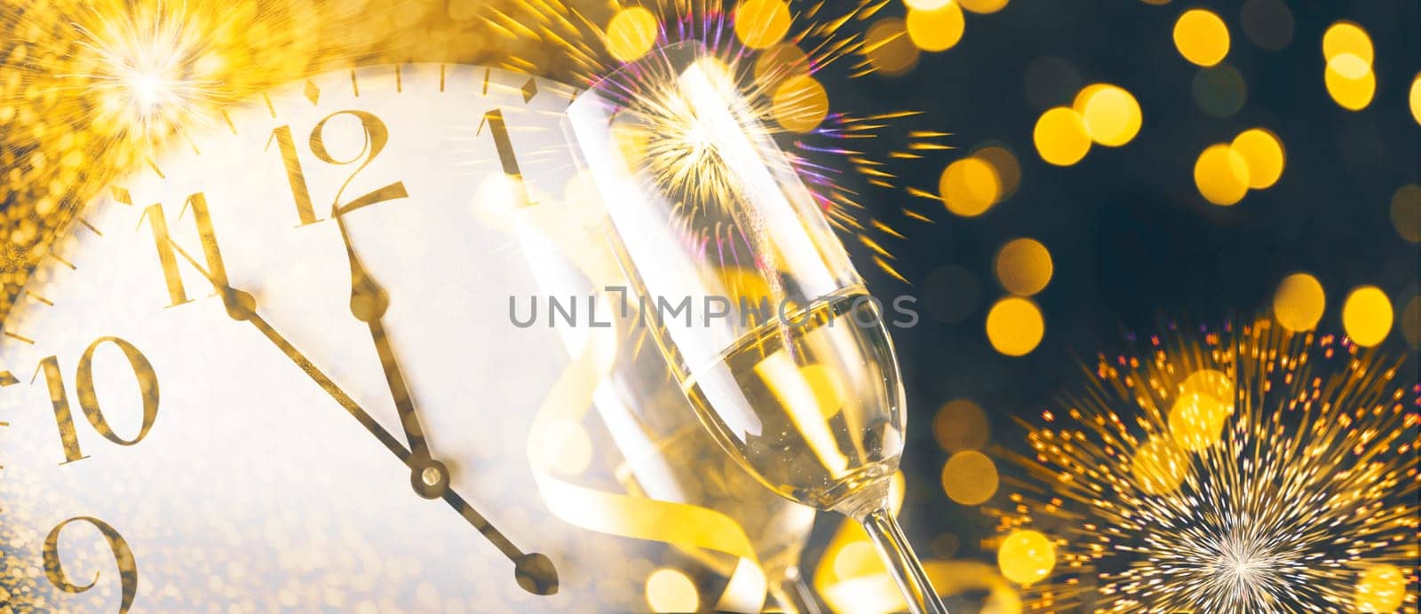 New year eve celebration with champagne flutes and midnight countdown  on golden firework bokeh background. Christmas party with blur confetti glitter, classy drink and vintage clock.