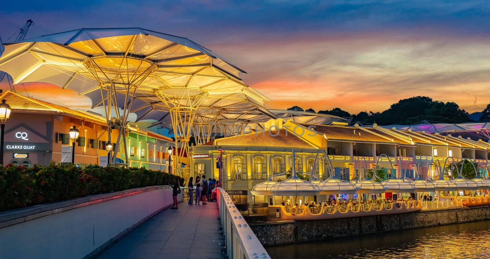 SINGAPORE - MAY 12, 2024: Clarke Quay after sunset, popular nightlife district of Singapore