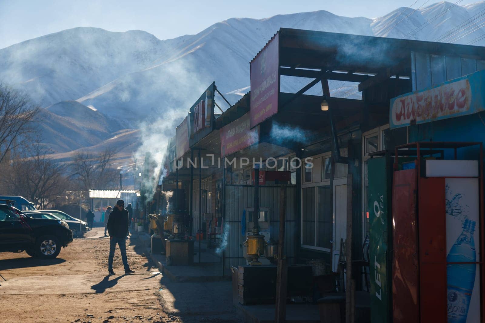 Row of Kyrgyz kattama cafe on side of the road to Issyk-Kul lake in Cholok, Kyrgyzstan at sunny day. Kattama - is a traditional Kyrgyz puff pastry.