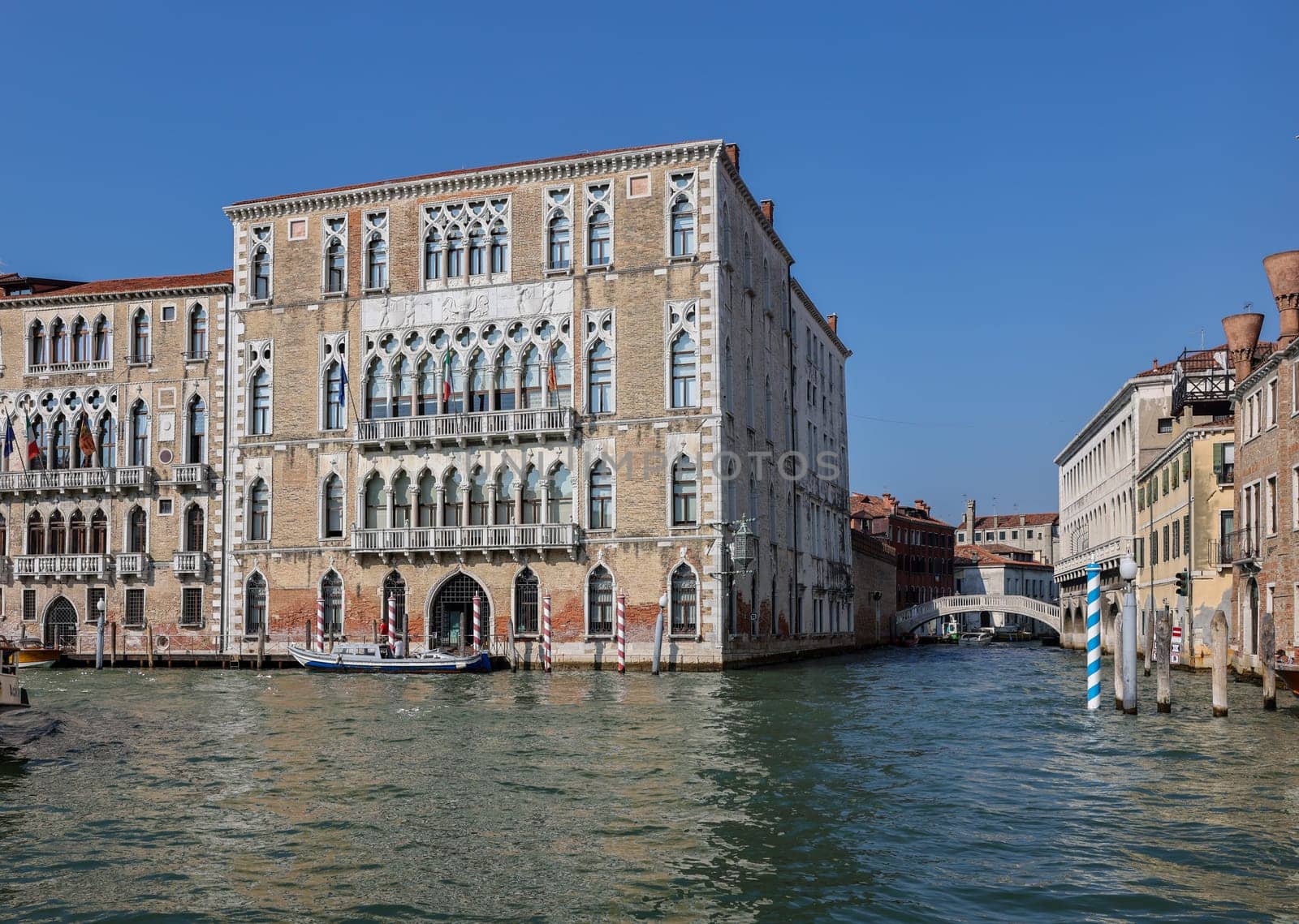 Venice, Italy - September 6, 2022: Ca' Foscari palace and the Giustinian palace  at Grand canal in the Dorsoduro district of Venice, Italy.