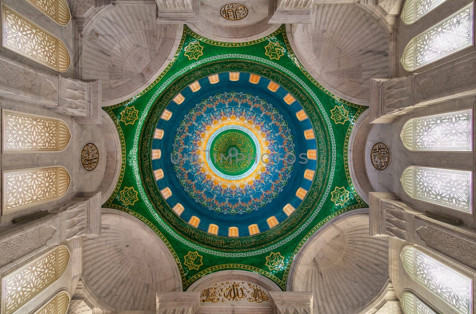 Photo of the ornate interior of Bibi-Heybat Mosque, with intricate details, vibrant colors, and beautiful patterns on the dome, Baku, Azerbaijan