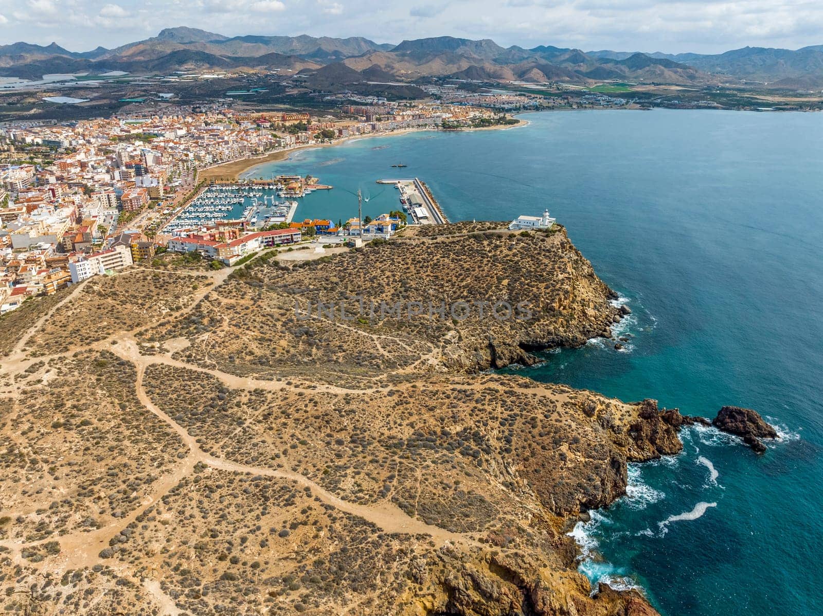 Panoramic aerial view of the fishing port and lighthouse of Mazarron, La Galerica, province of Murcia. Spain