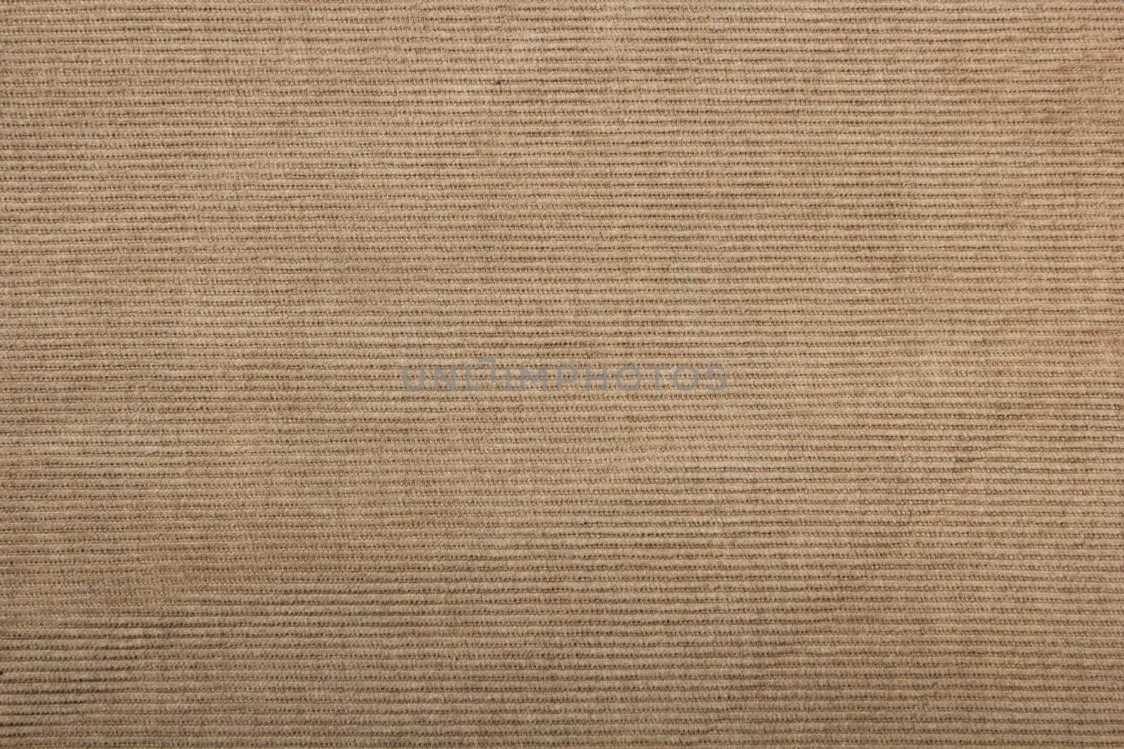 beige corduroy fabric background. slightly worn