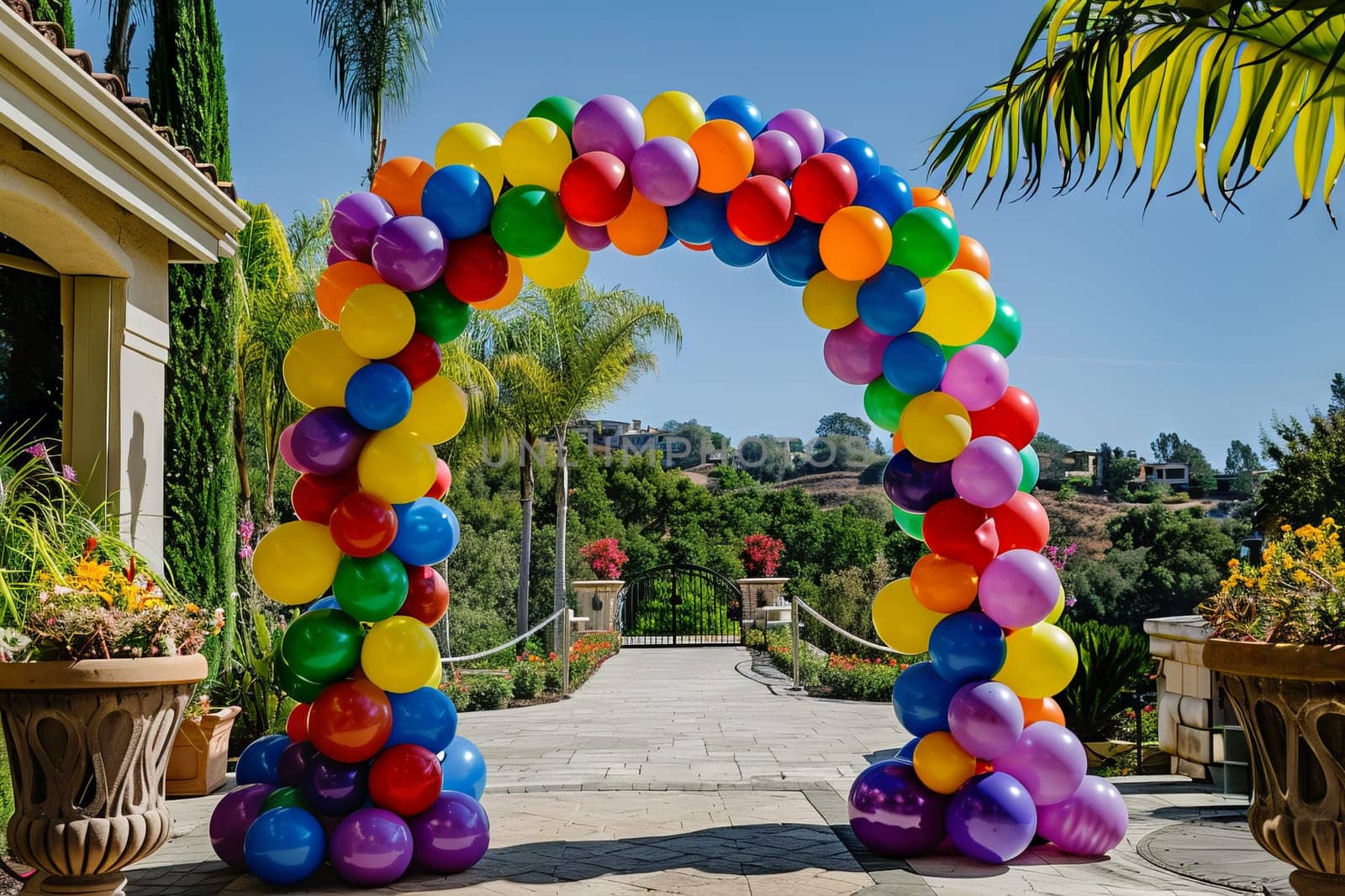 Colorful balloon arch framing a party entrance, inviting guests to celebrate