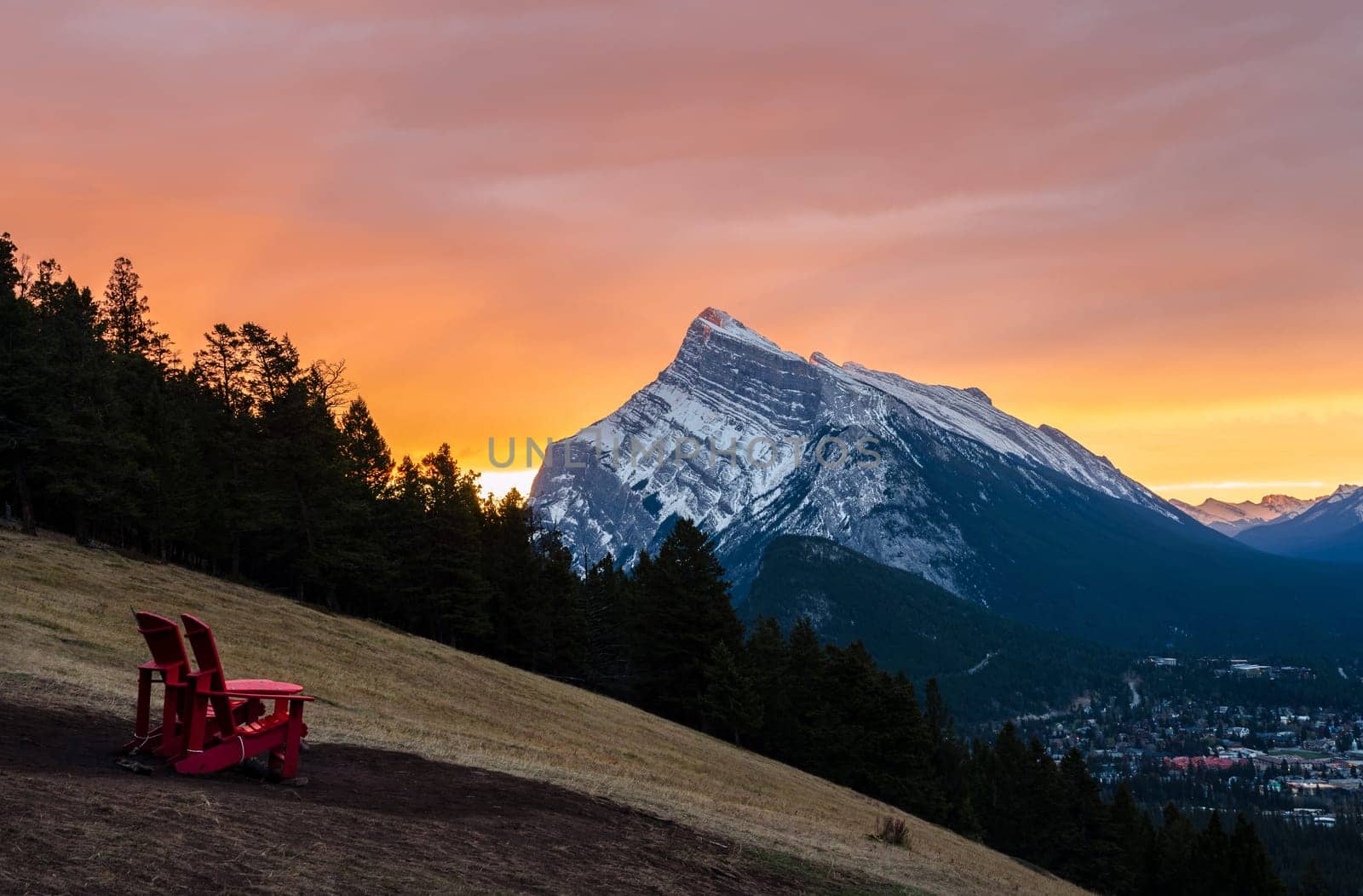Stunning sunrise scenery of Mount Rundle and Banff town in Banff National Park in Alberta, Canada. Seen from a vantage point on the road to Mount Norquay.