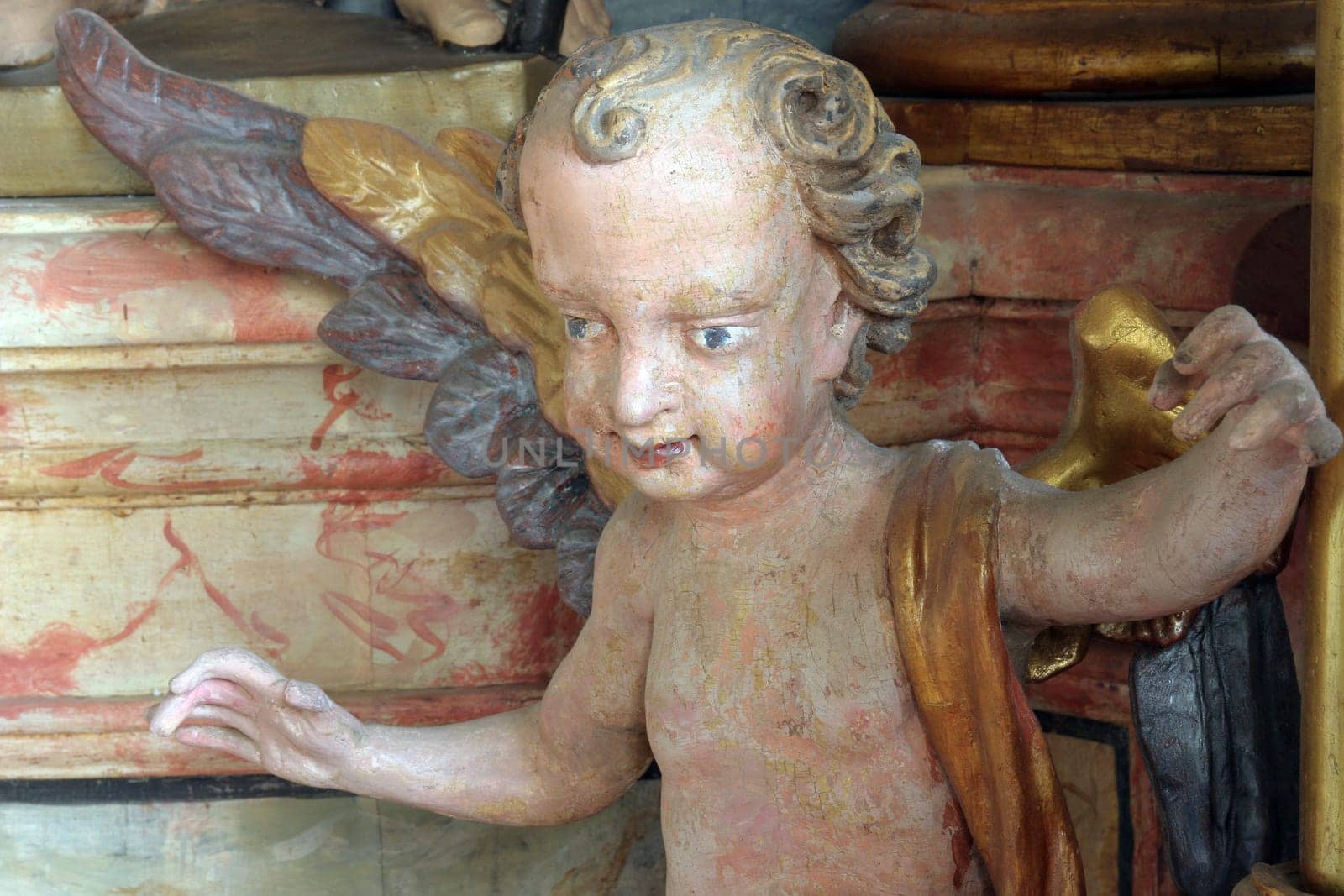 Angel statue on altar in the church of Holy Trinity in Klenovnik, Croatia