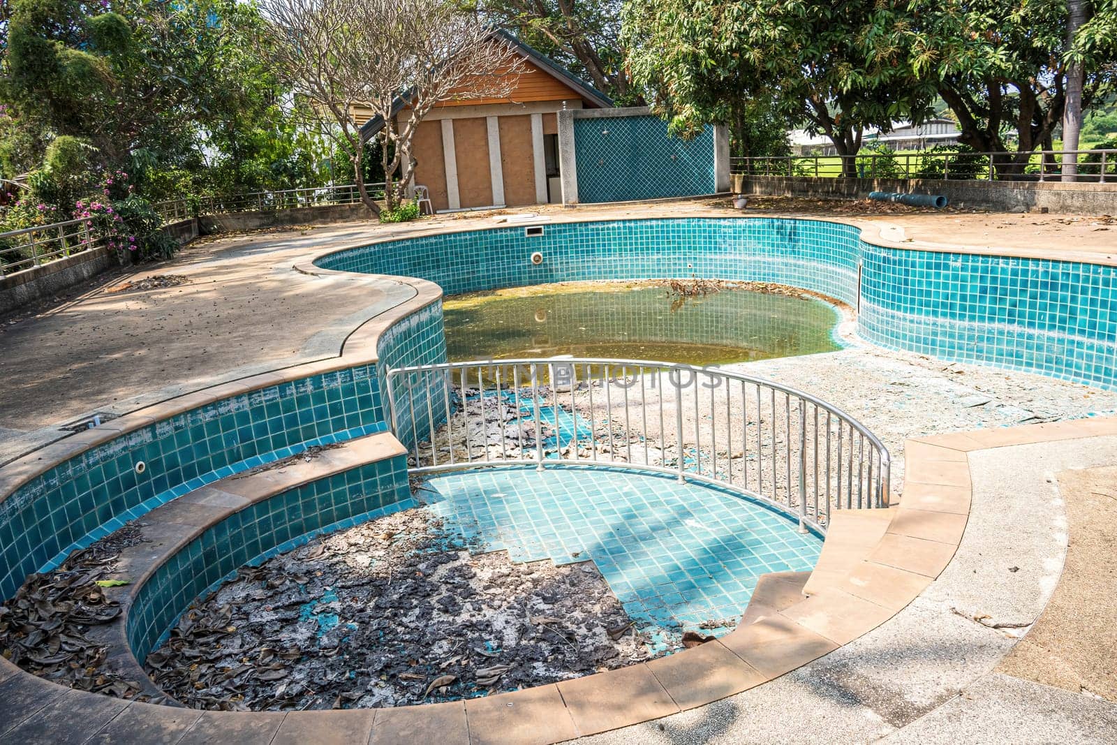 Abandoned swimming pool in the garden house.
