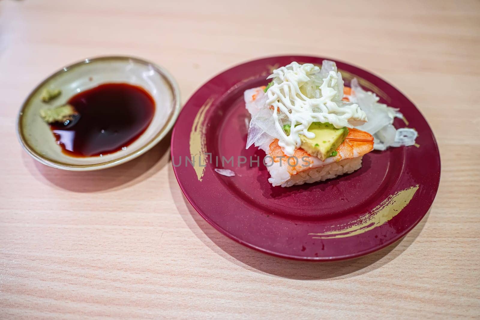 Avocado shrimp sushi in the plate. Sushi is a type of food preparation originating in Japan.