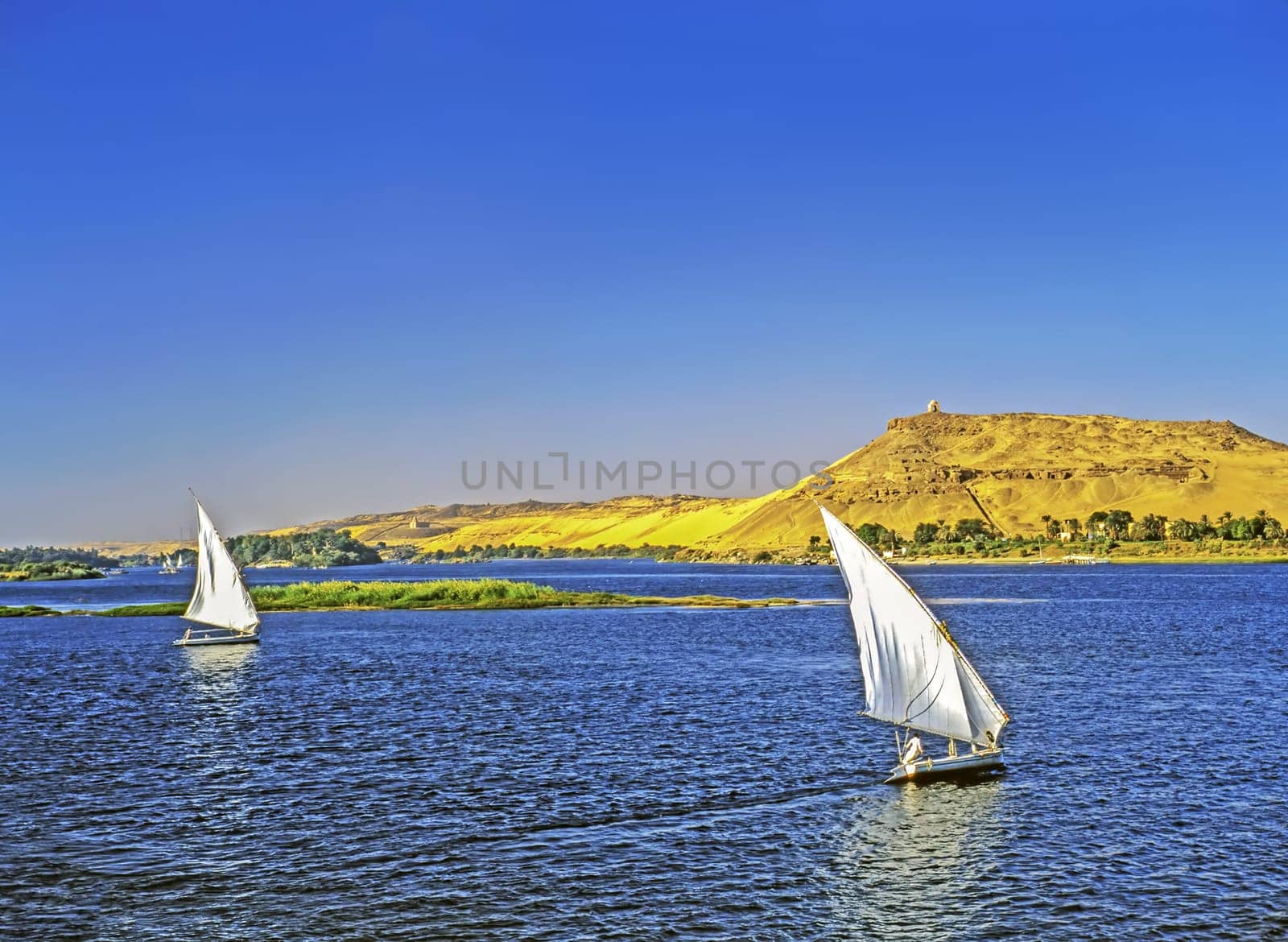 Feluccas on River Nile in background monument  to  Aga Khan