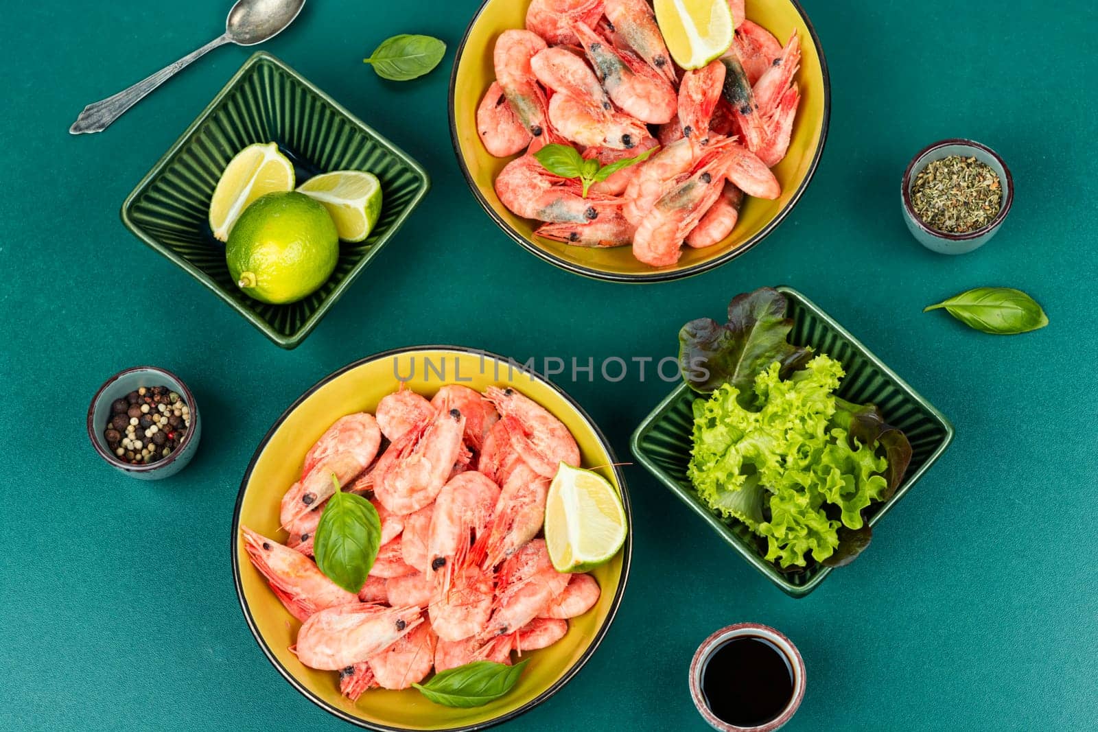 Raw unpeeled prawns or shrimps with an assortment of cooking spices.