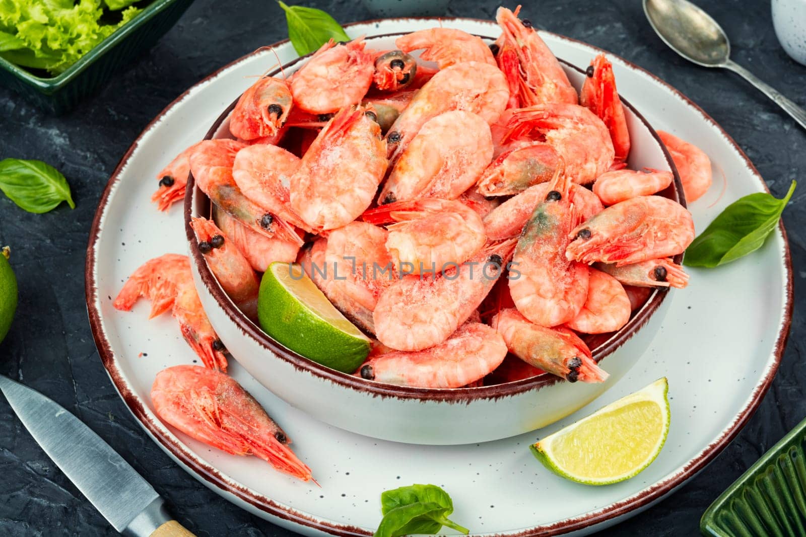 Raw unpeeled prawns or shrimps with an assortment of cooking spices.