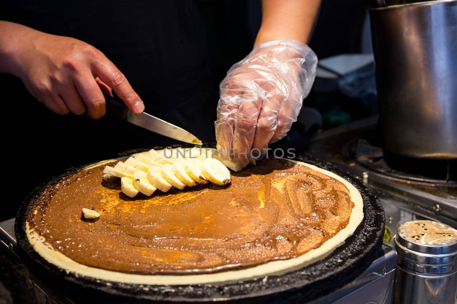 Street food making crepe cake with chocolate and banana