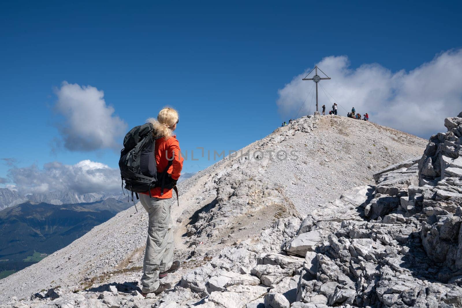 Prags, Italy - August 21, 2022: Sportiv woman trecking to the peak, Dolomites in South Tirol on August 21, 2022 in Italy, Europe