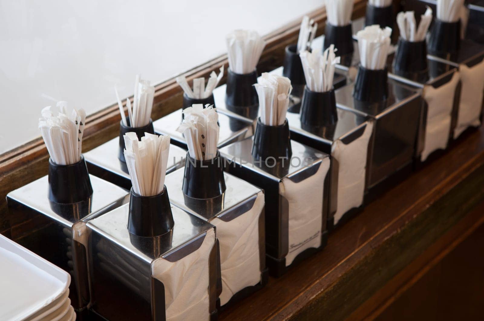 Napkin holders with toothpick dispenser on top. Table service concept