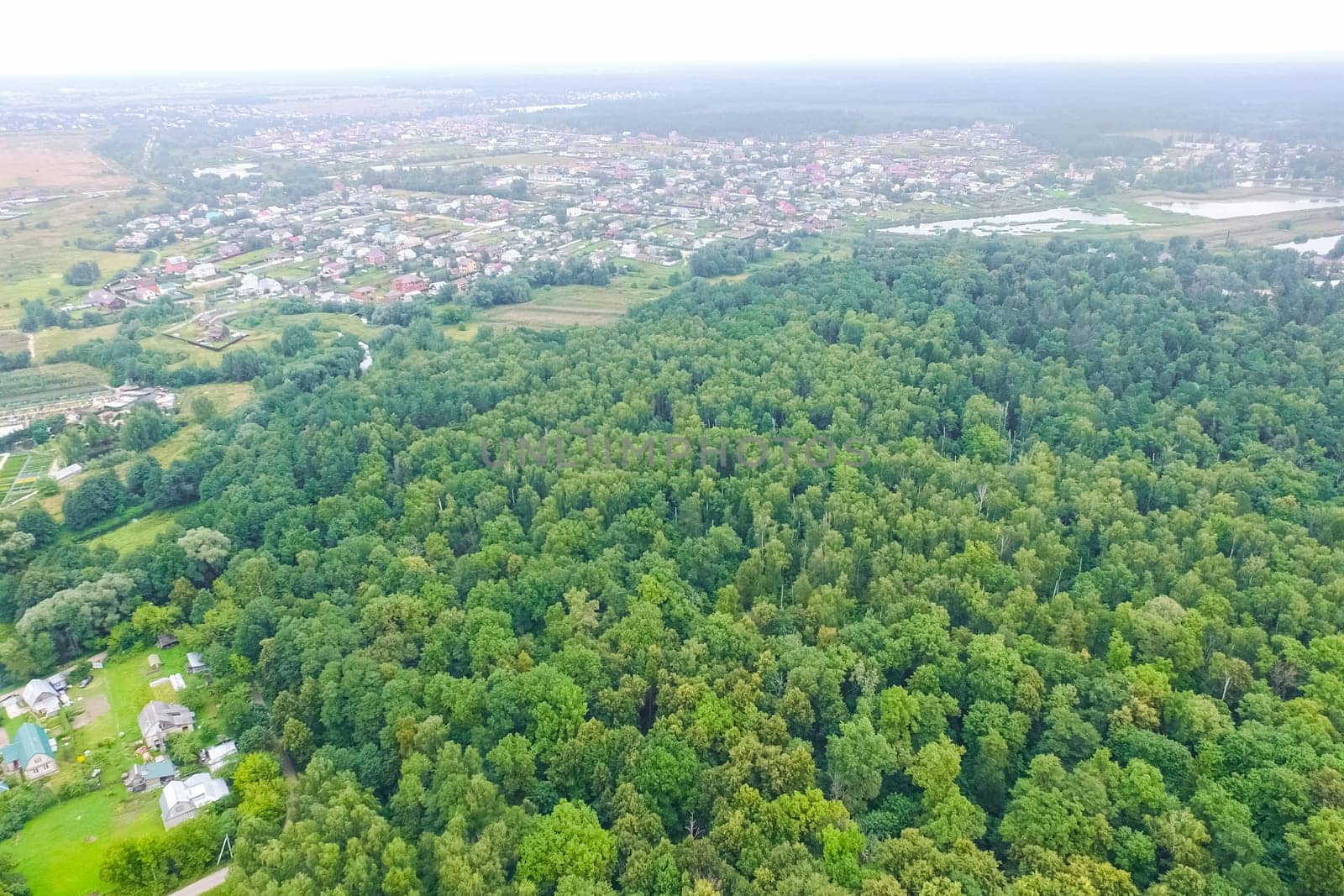 Top view of the village, fields and forests near the village