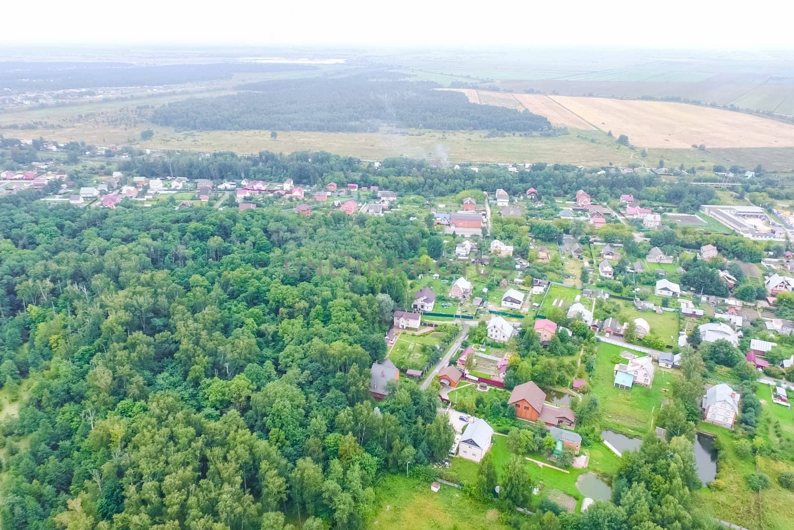 Top view of the village, fields and forests near the village
